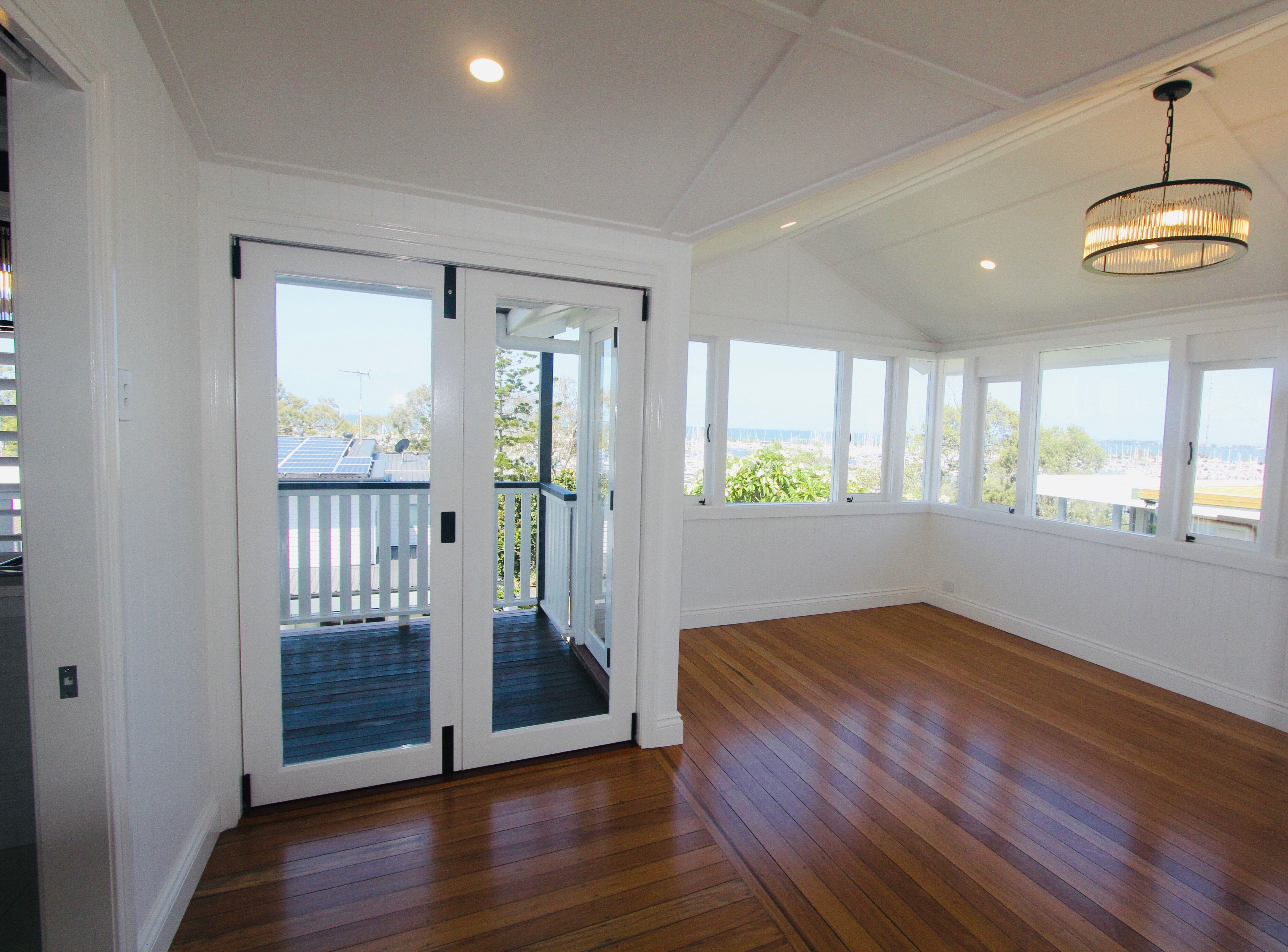 White Bifold doors with black handles