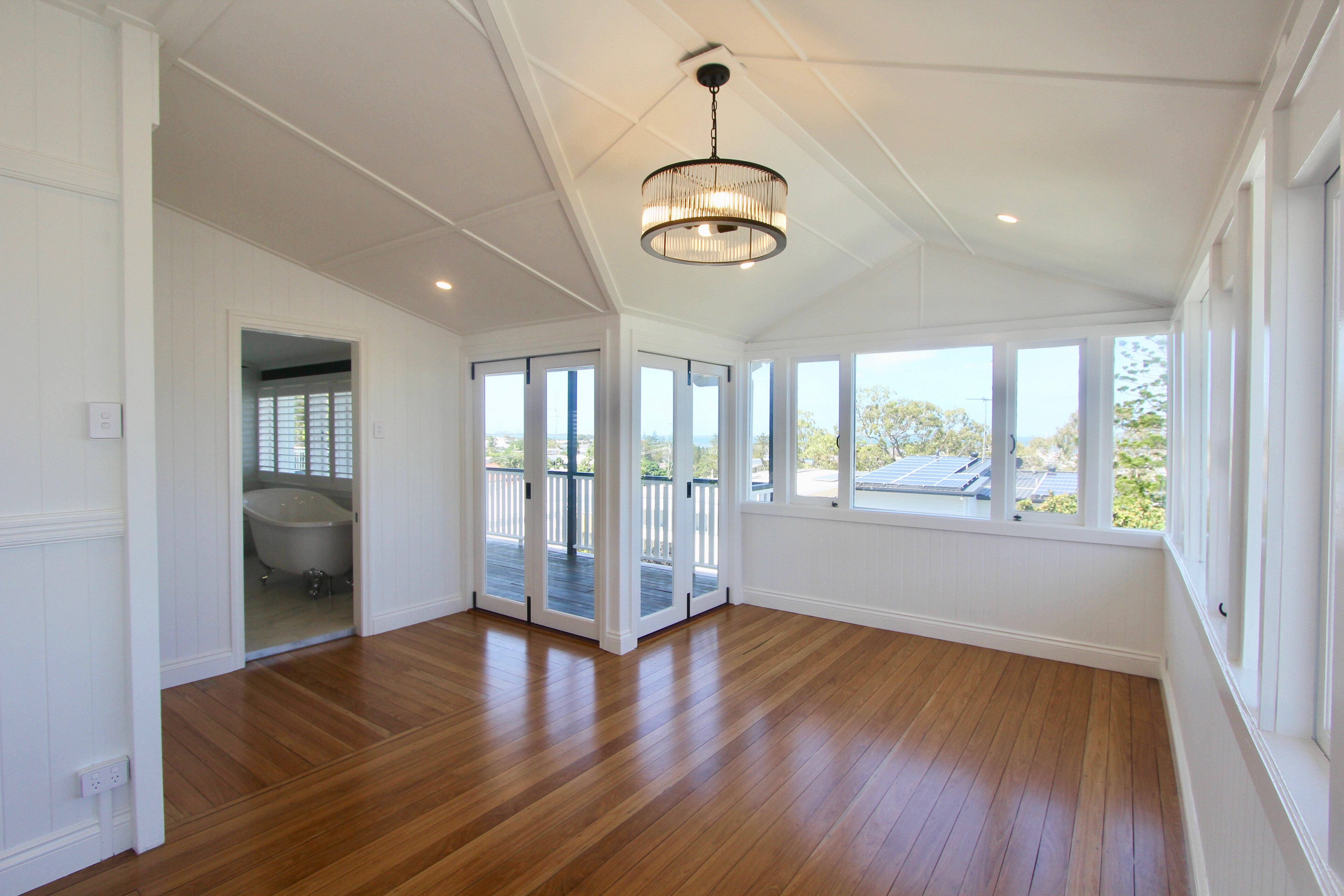 Timber floors and pendant light in dining room