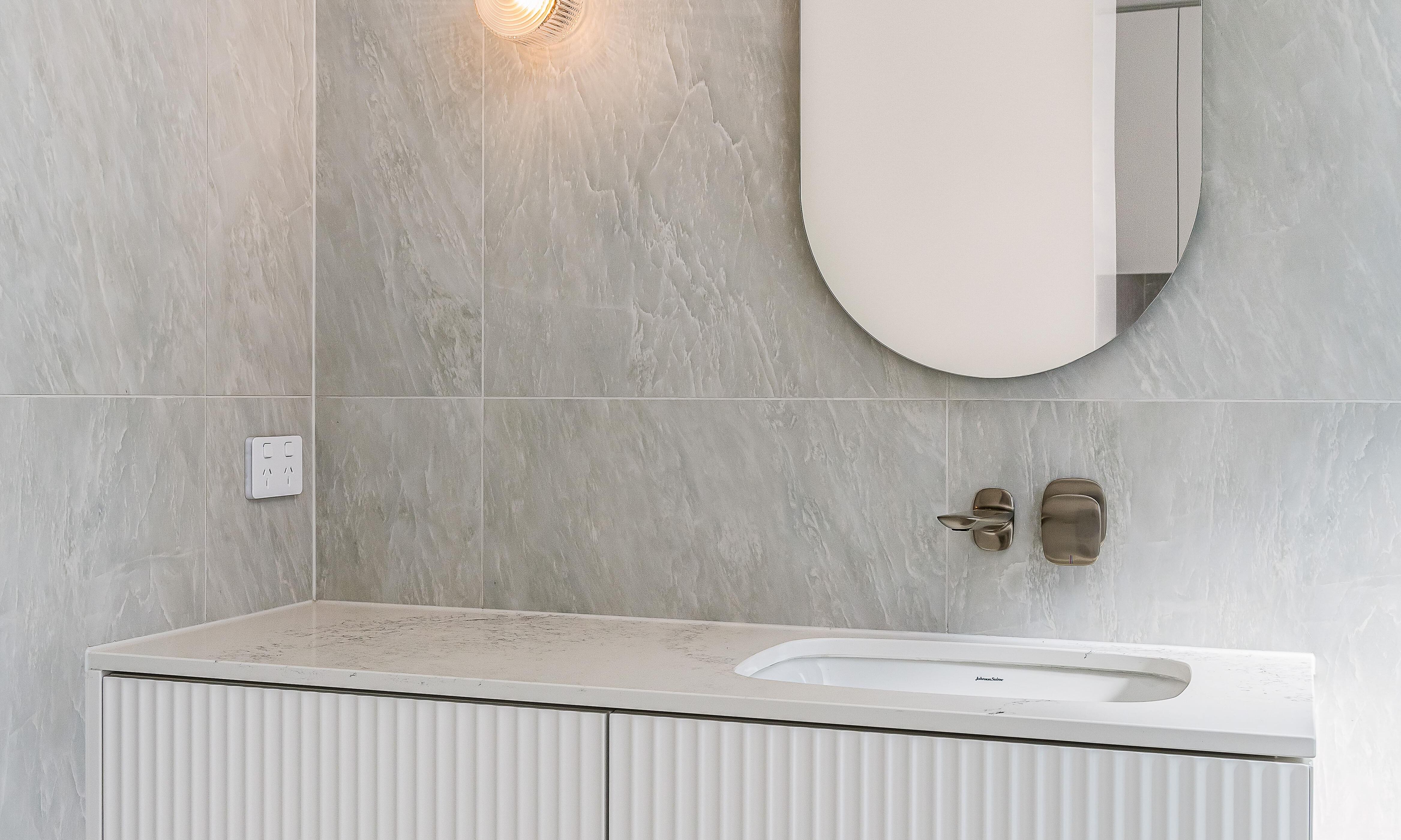 Bathroom, wall Hung Vanity and oval mirror in bathroom