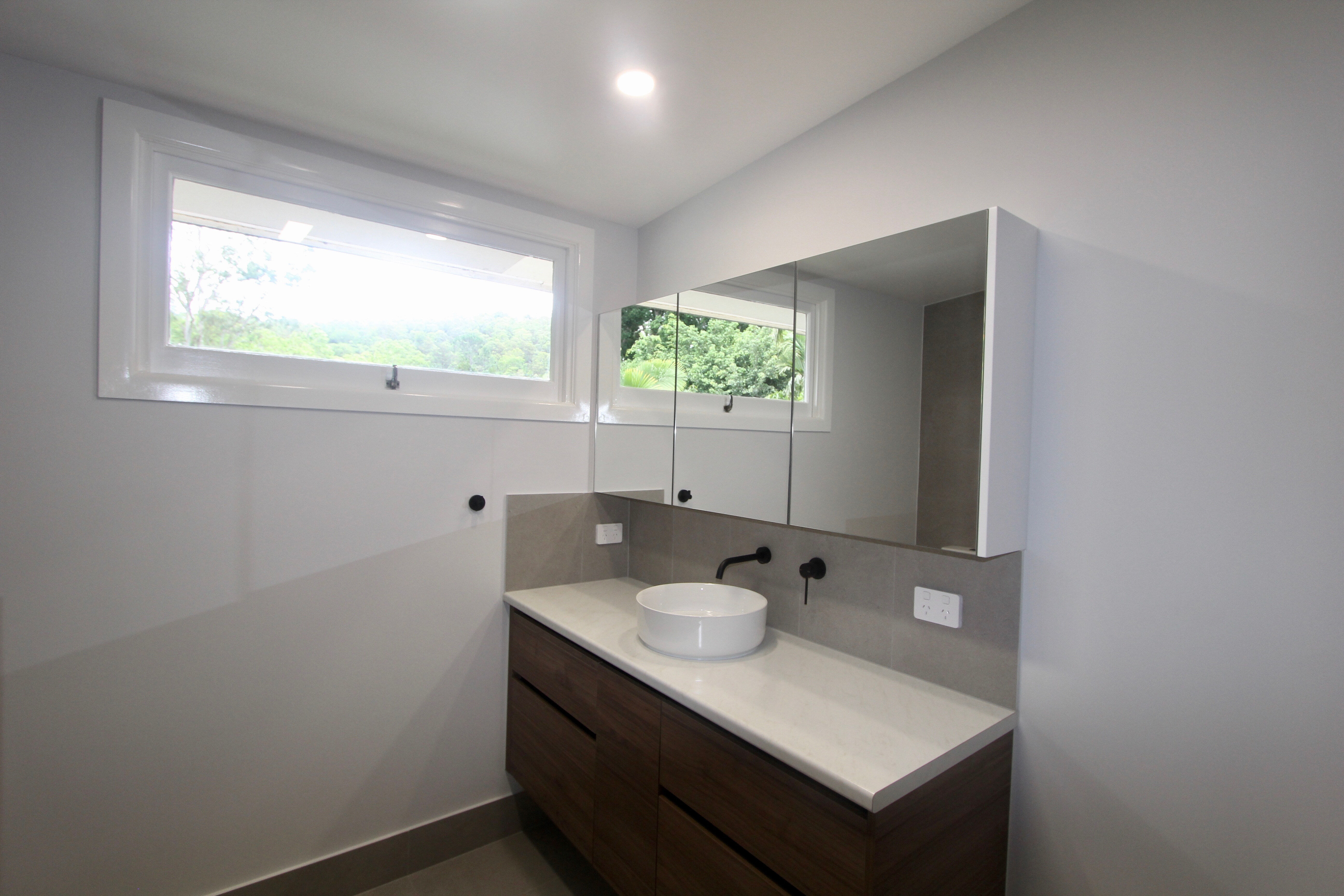 Floating Vanity and Mirrored Shaving Cabinet in Bathroom at The Gap