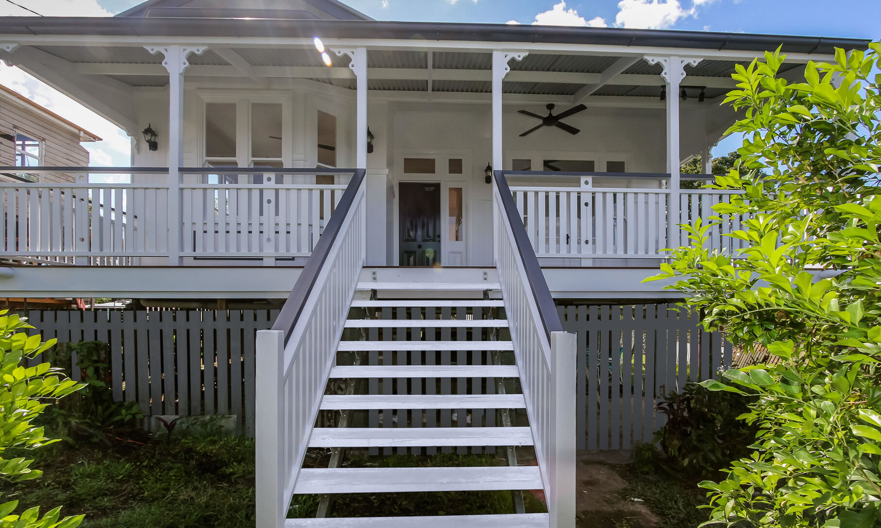 Front deck with large bay window in Queenslander renovation