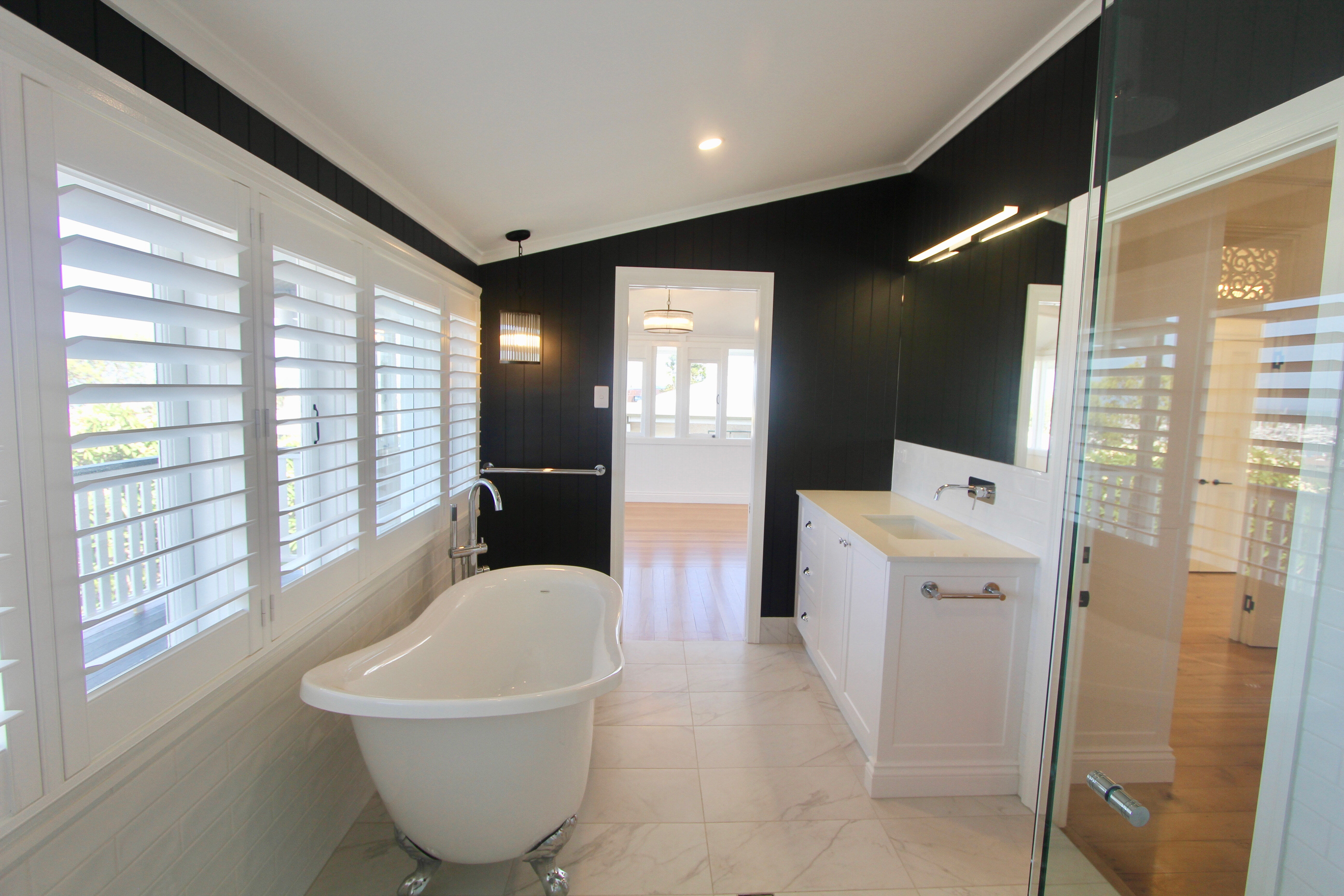 Clawfoot bath in black and white bathroom