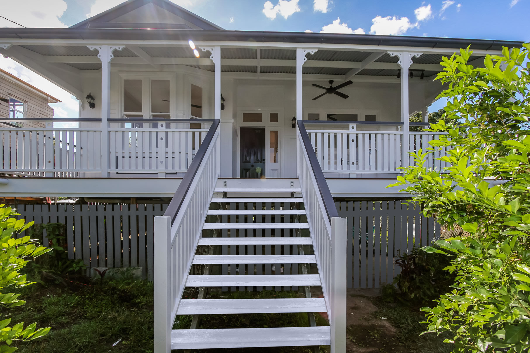 Front deck with large bay window in Queenslander renovation