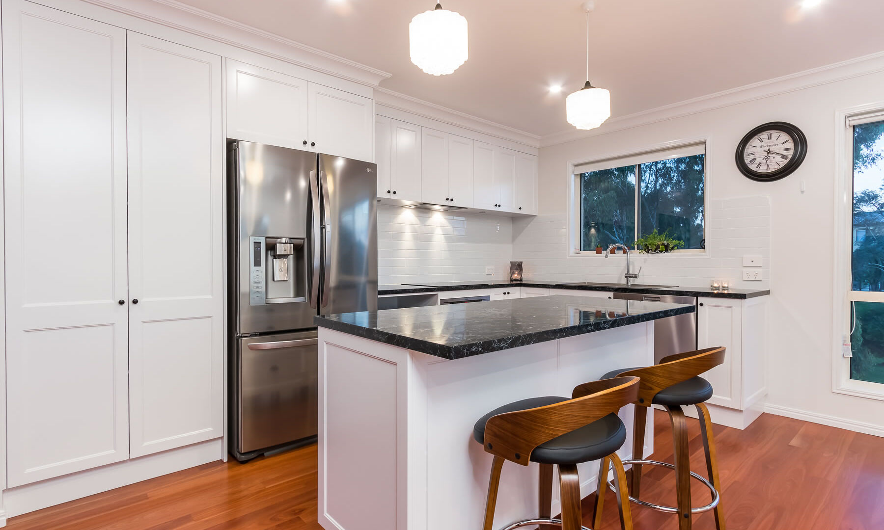 White kitchen-timber floors-stone benchtop