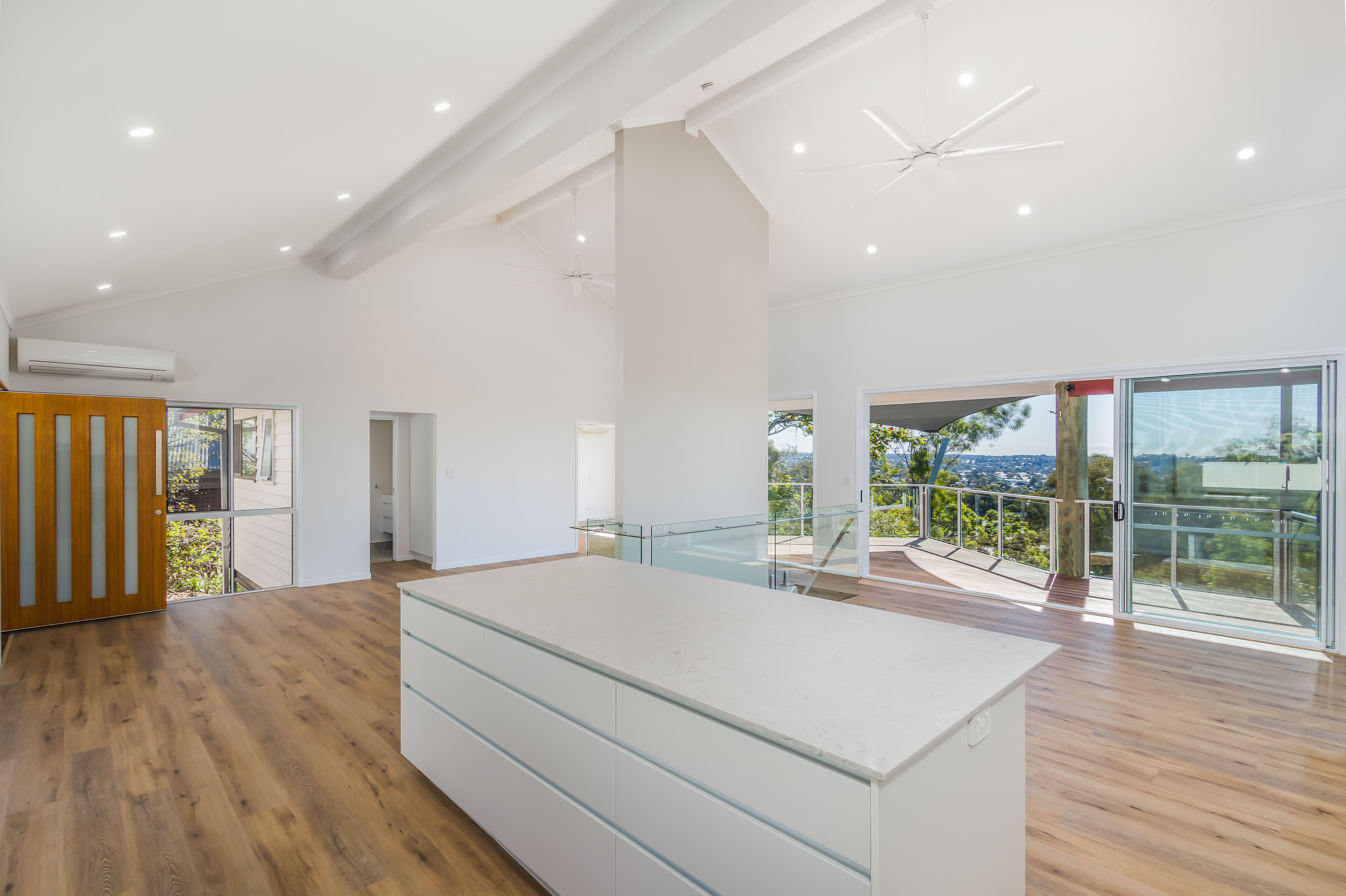 Kitchen island and deck-timber entry door-open plan living