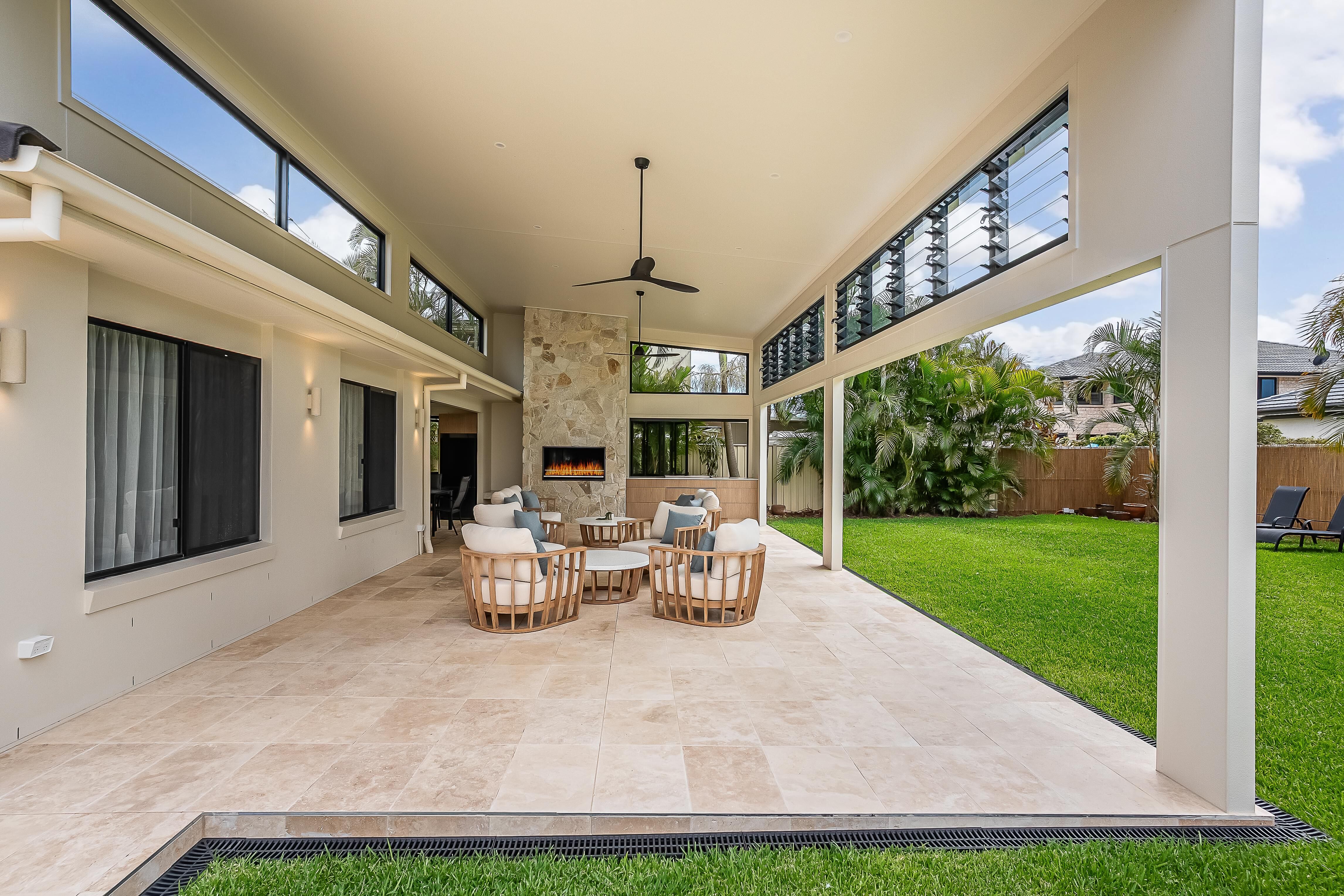 Sweetapple - bifold windows, outdoor kitchen, travertine tiles,  outdoor entertaining