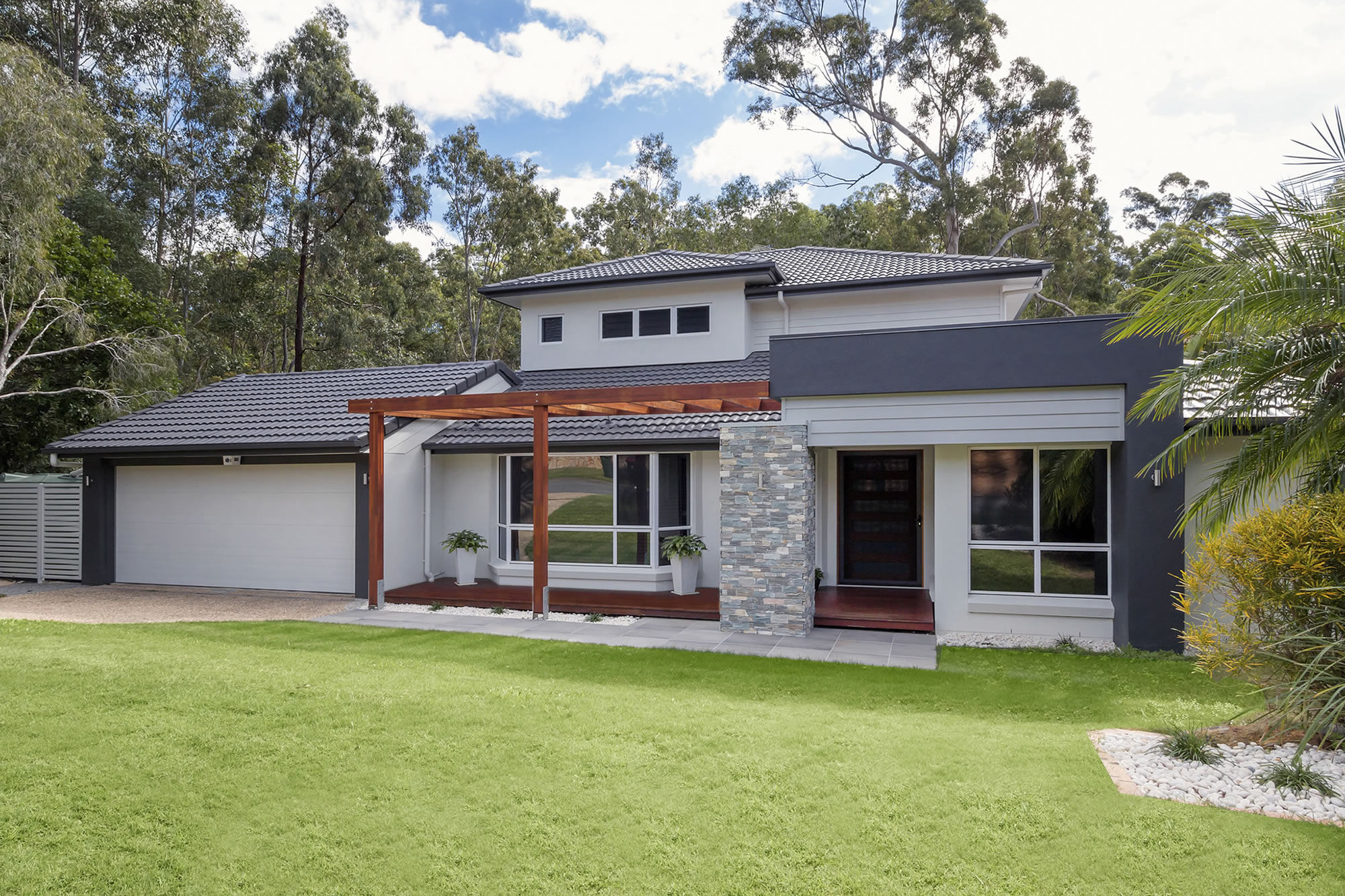 Front house with tiled entry and timber pergola