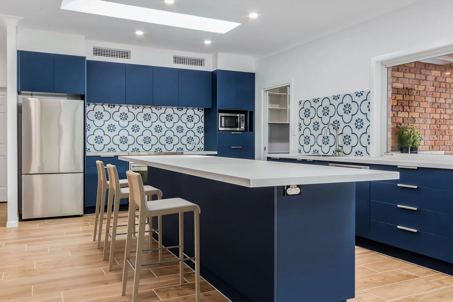 Blue Kitchen with blue and white tiles