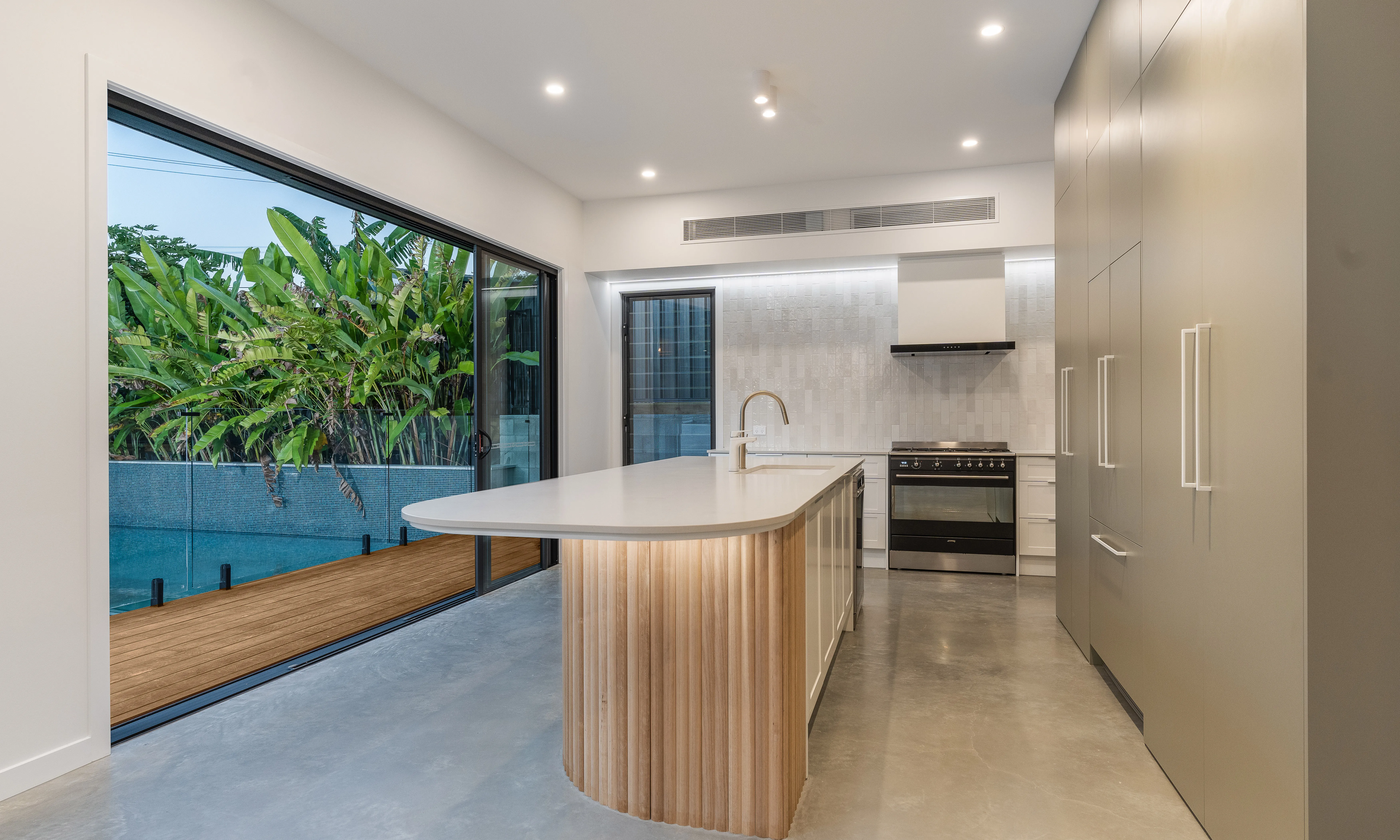 Kitchen island-polished floors-fluted panels