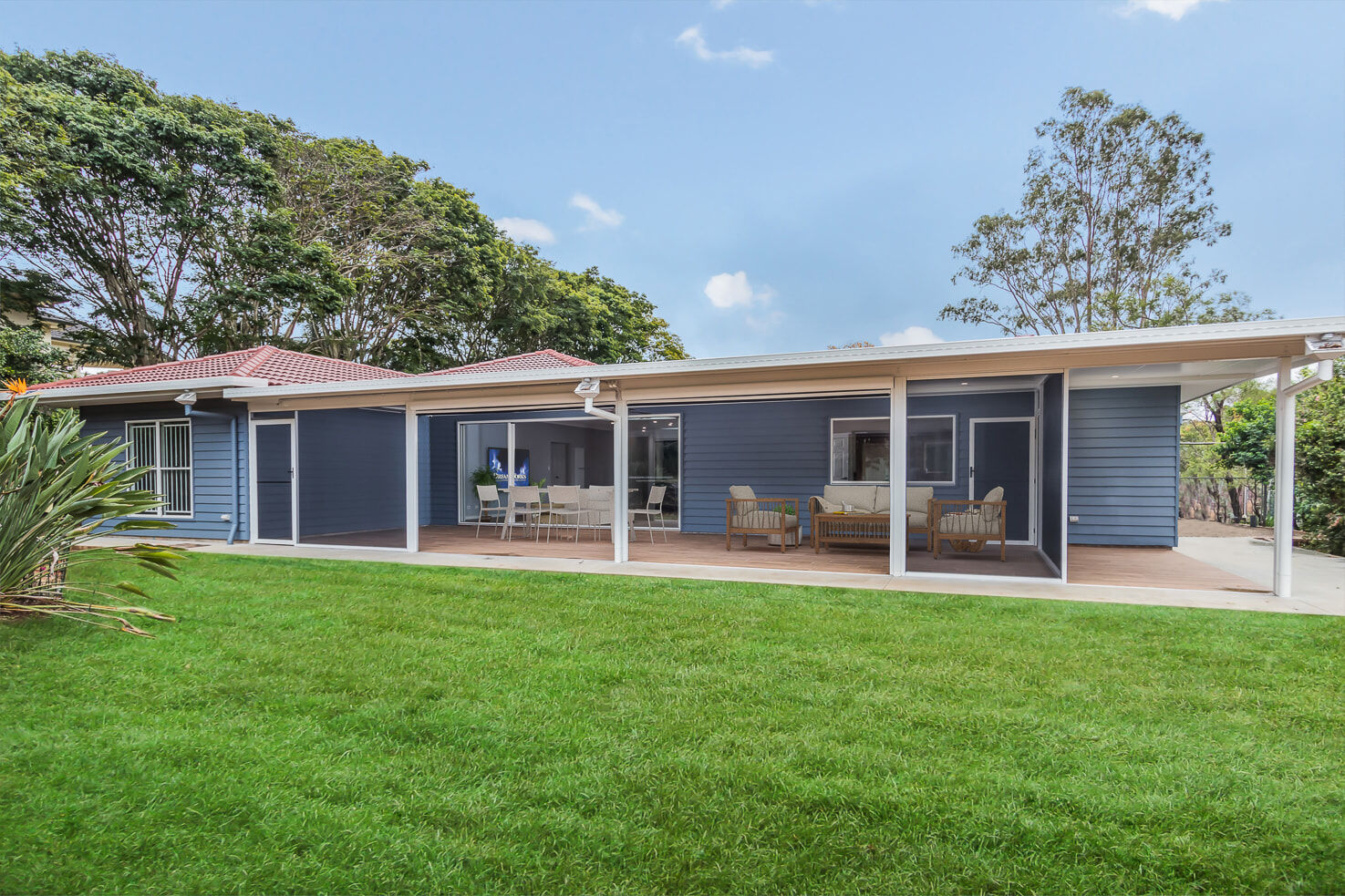 Back Yard of single storey blue weatherboard house