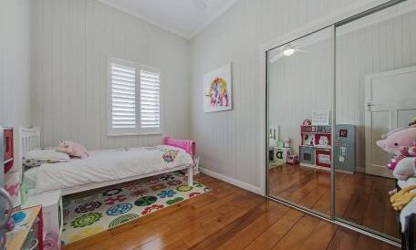 Bedroom-VJ walls-timber floors-mirrored robe doors