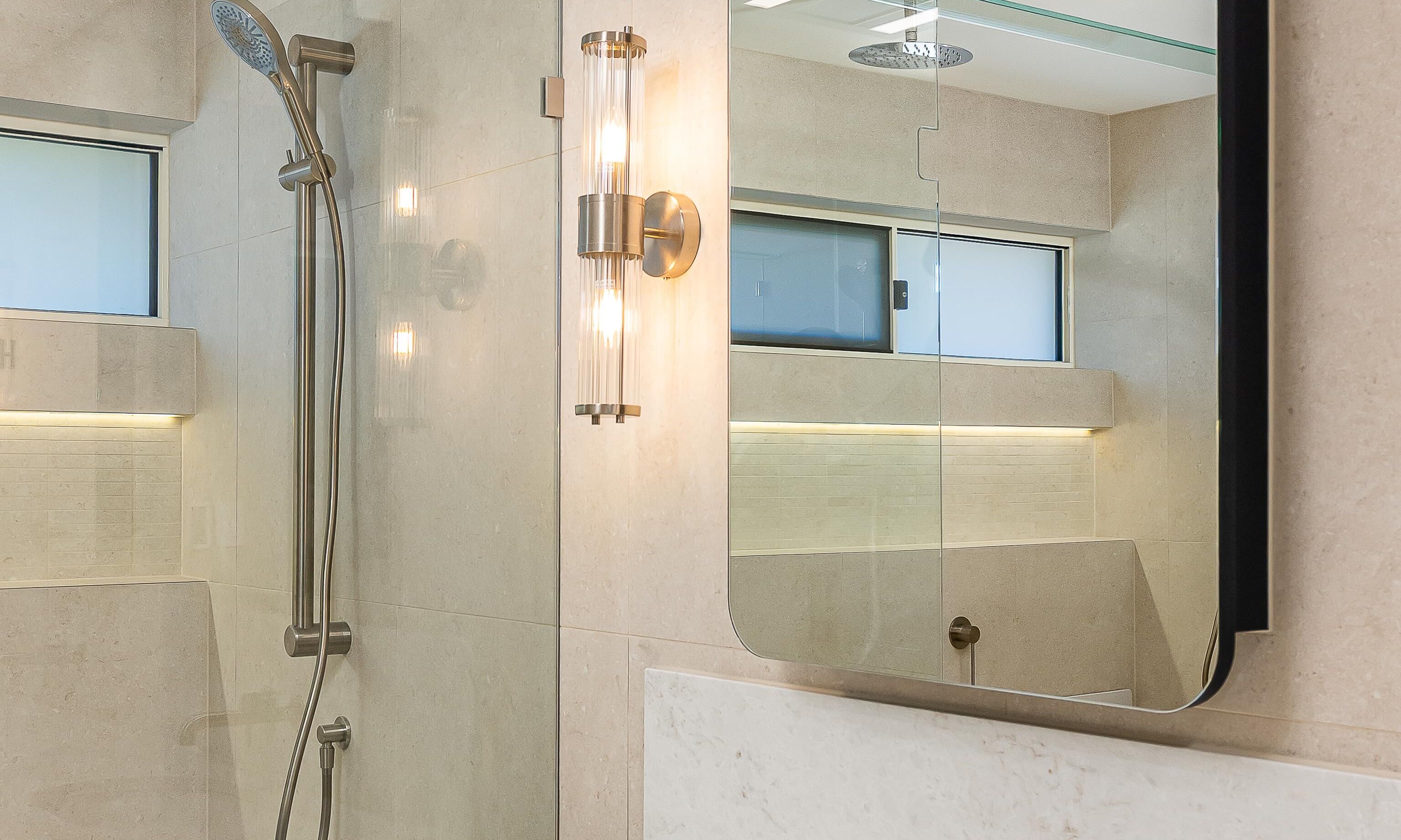 Beckenham brushed nickle tapware, caesarstone top, mirrored shaving cabinets, wall lights