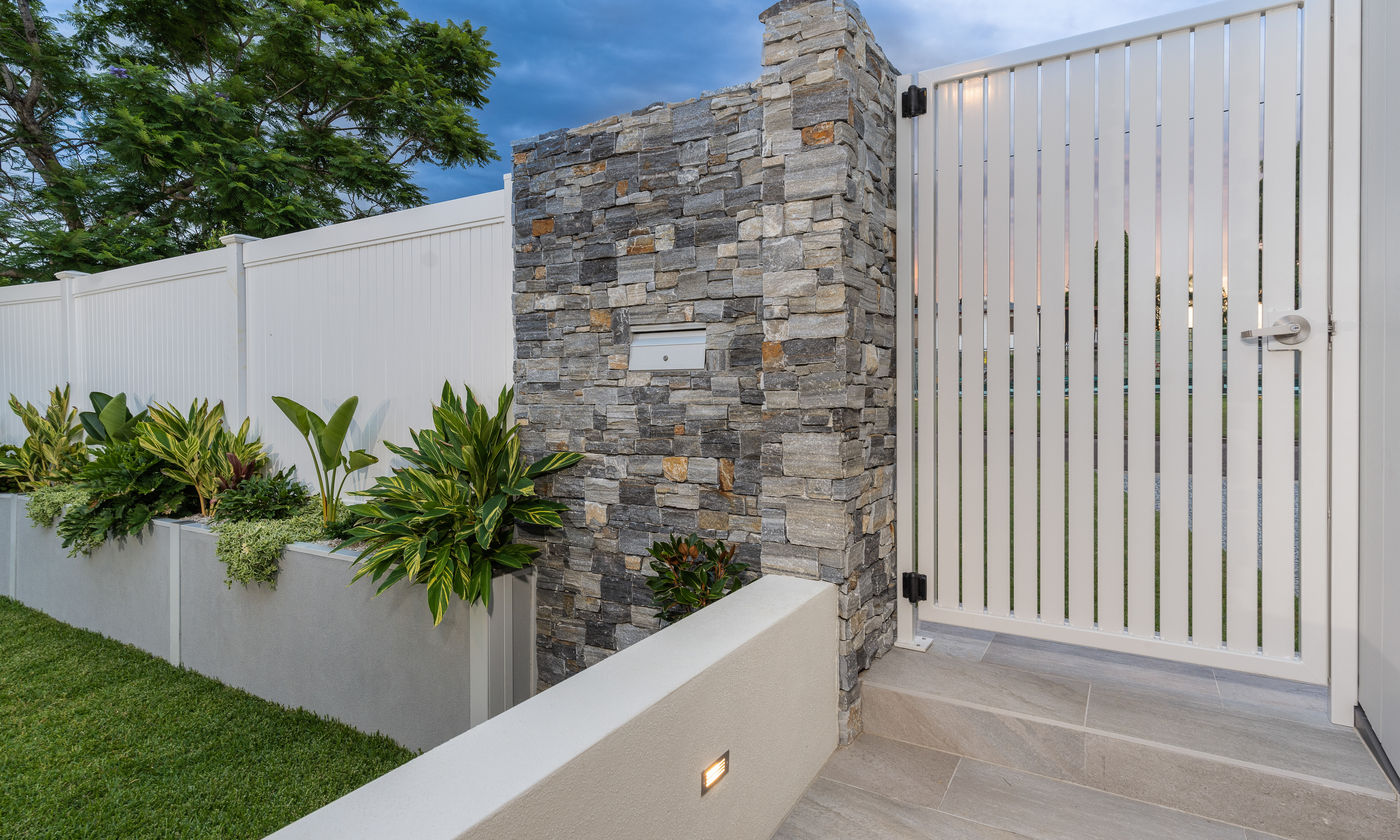 Gate and feature wall front entry- tiles-lights