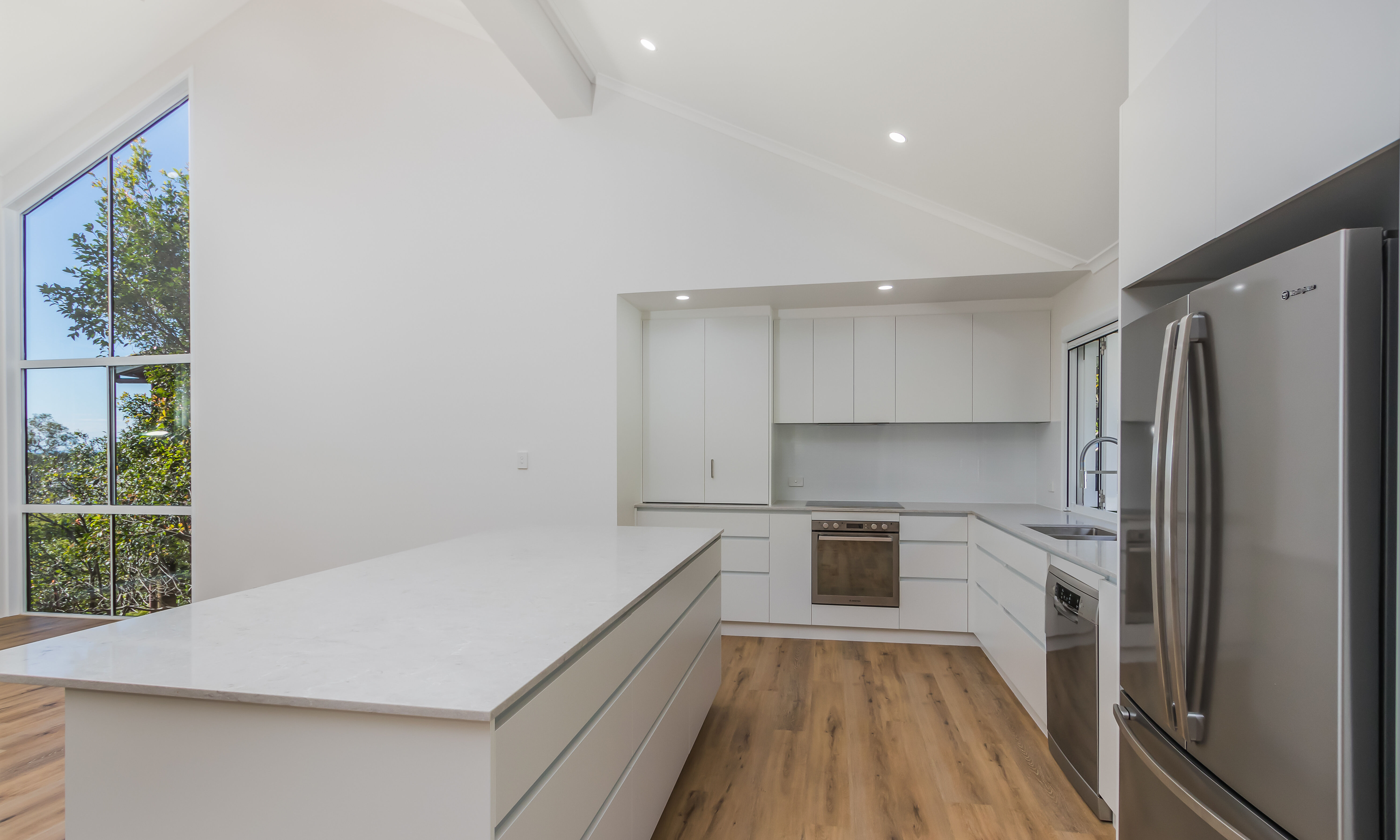 Kitchen-white cabinets-timber floors-large window