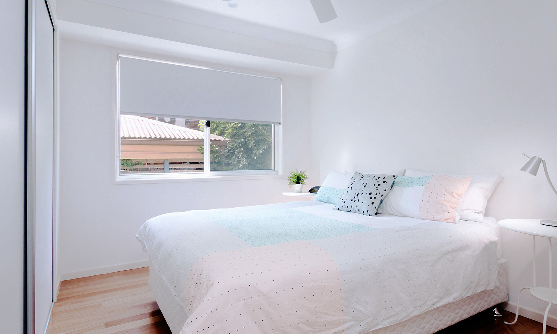 Bedroom with white sliding robe doors