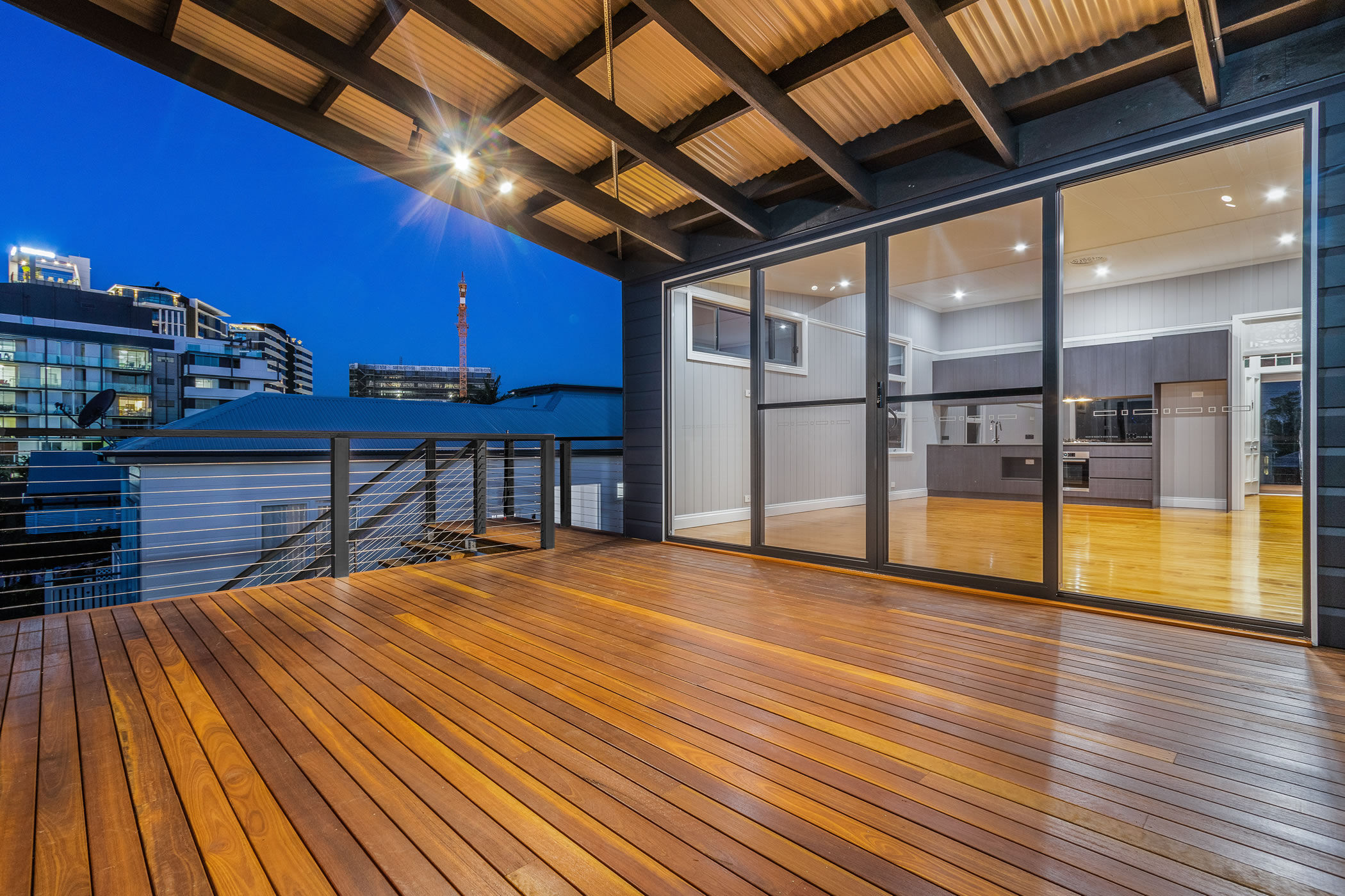 Large rear deck with wire balustrade and Spotted Gum decking boards