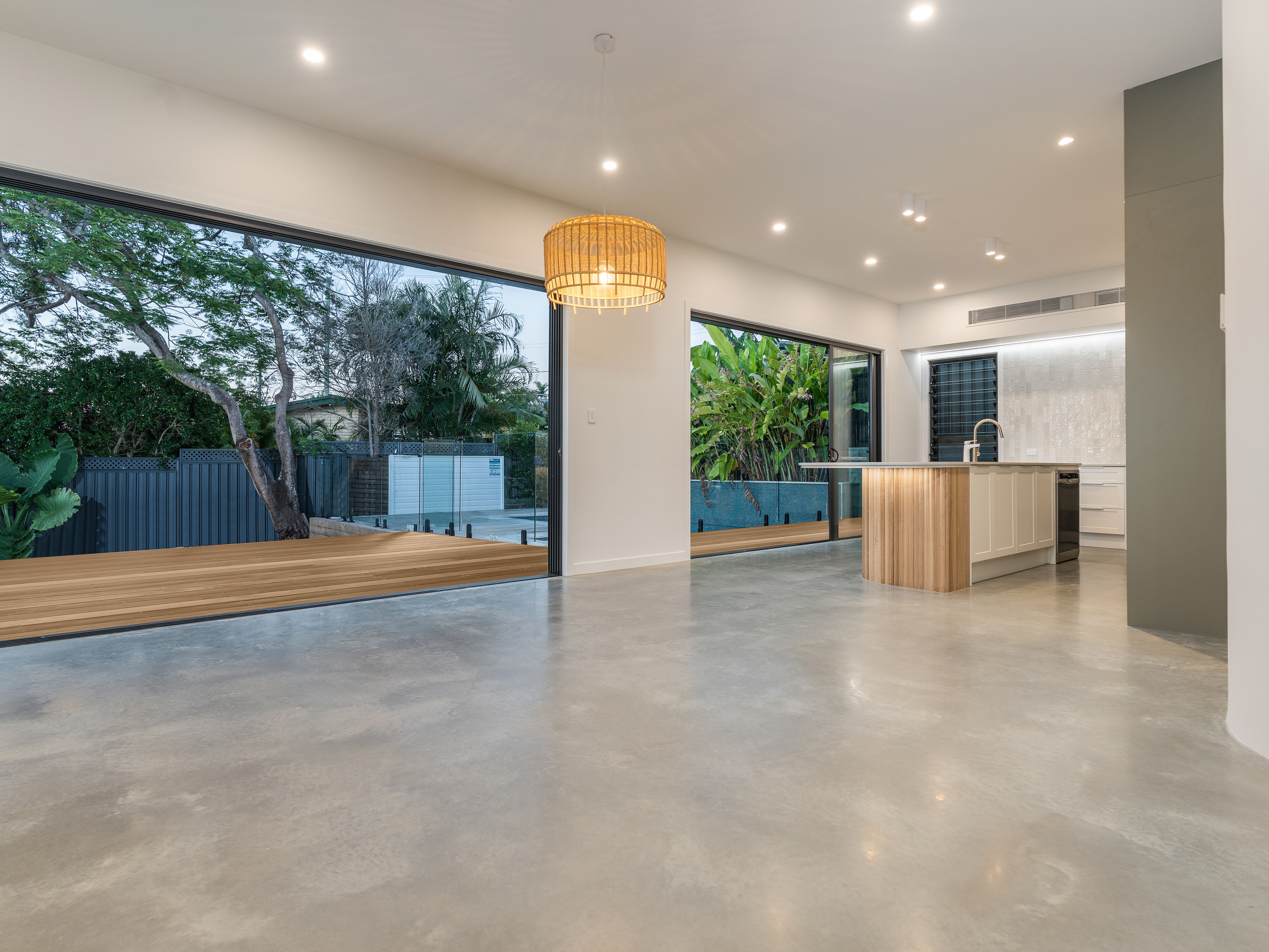 Living room-polished floors- Stacker door-pool-deck