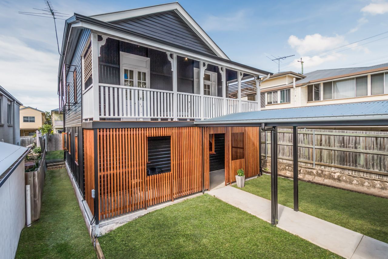 Black and White House with timber battening