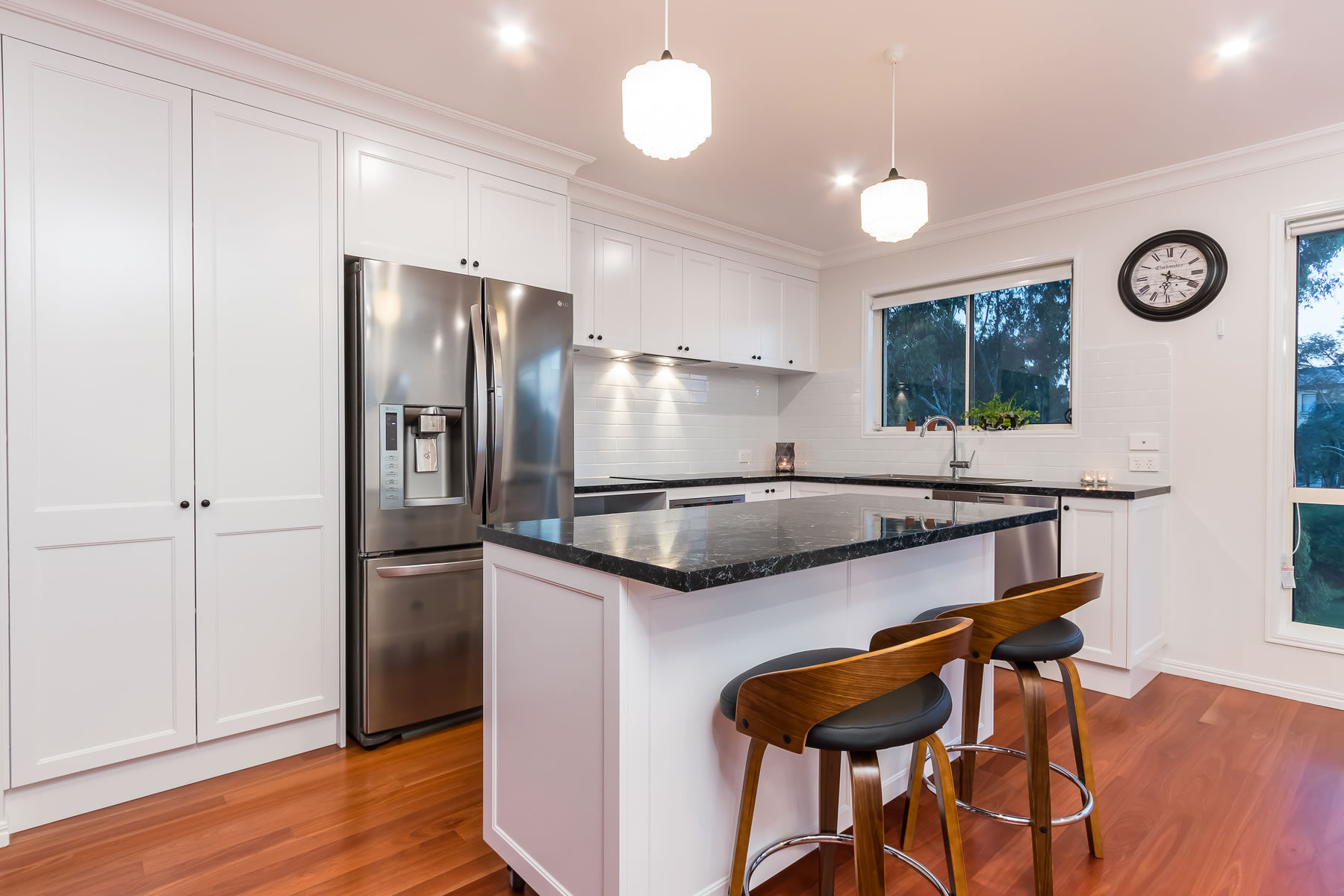 White kitchen-timber floors-stone benchtop