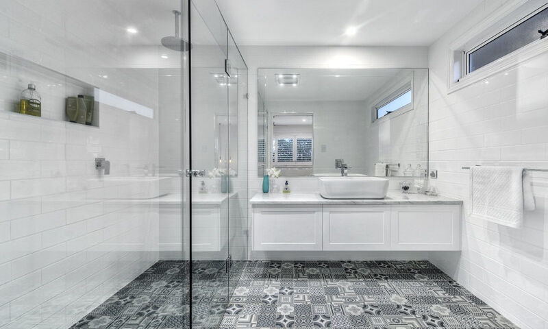 bathroom-white vanity-shower screen-black and white tiles