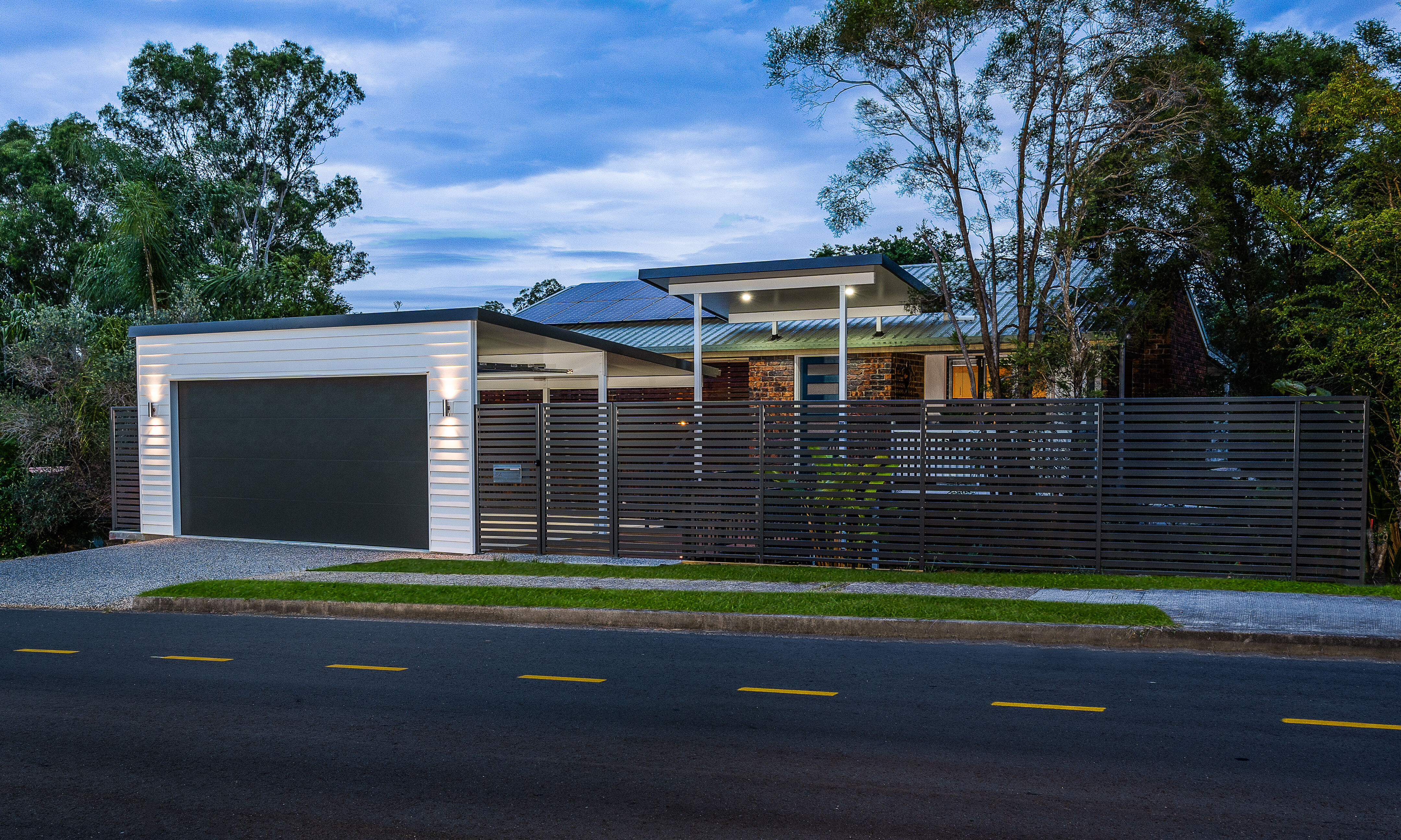 Carport door and powder coated front boundary fencing in horizontal slats