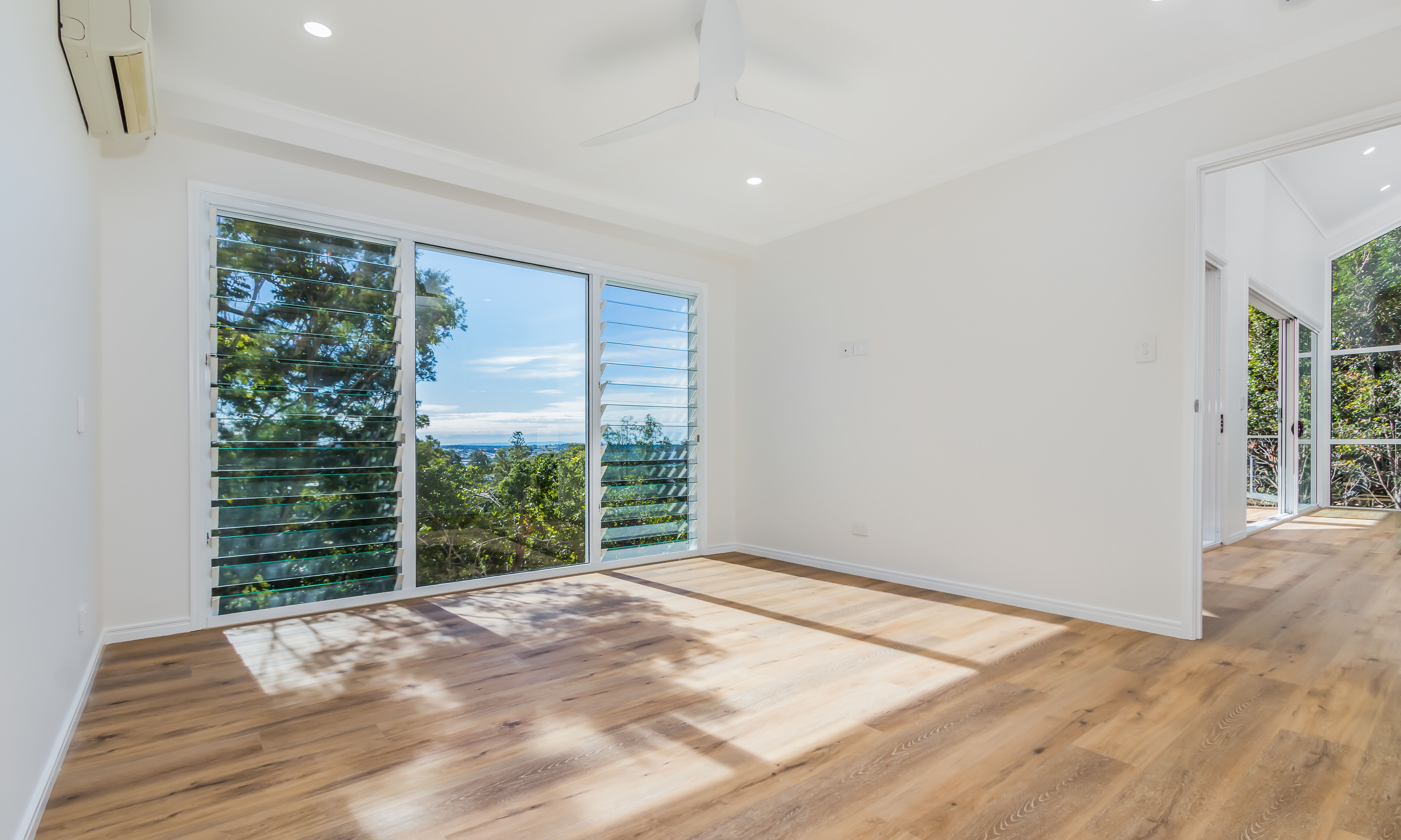 Bedroom- louvred windows-timber floors