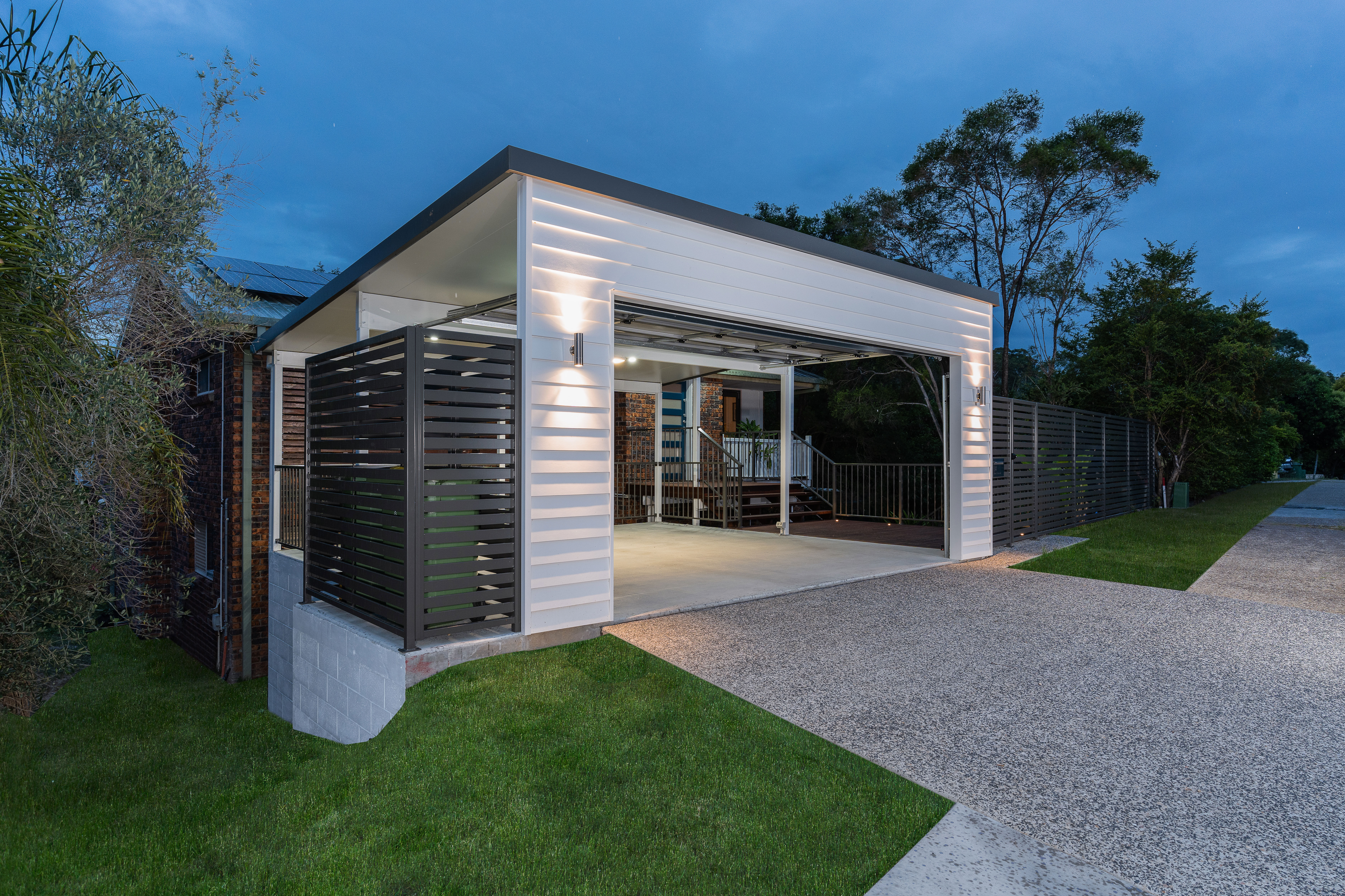 Carport and  front boundary fencing in horizontal slats