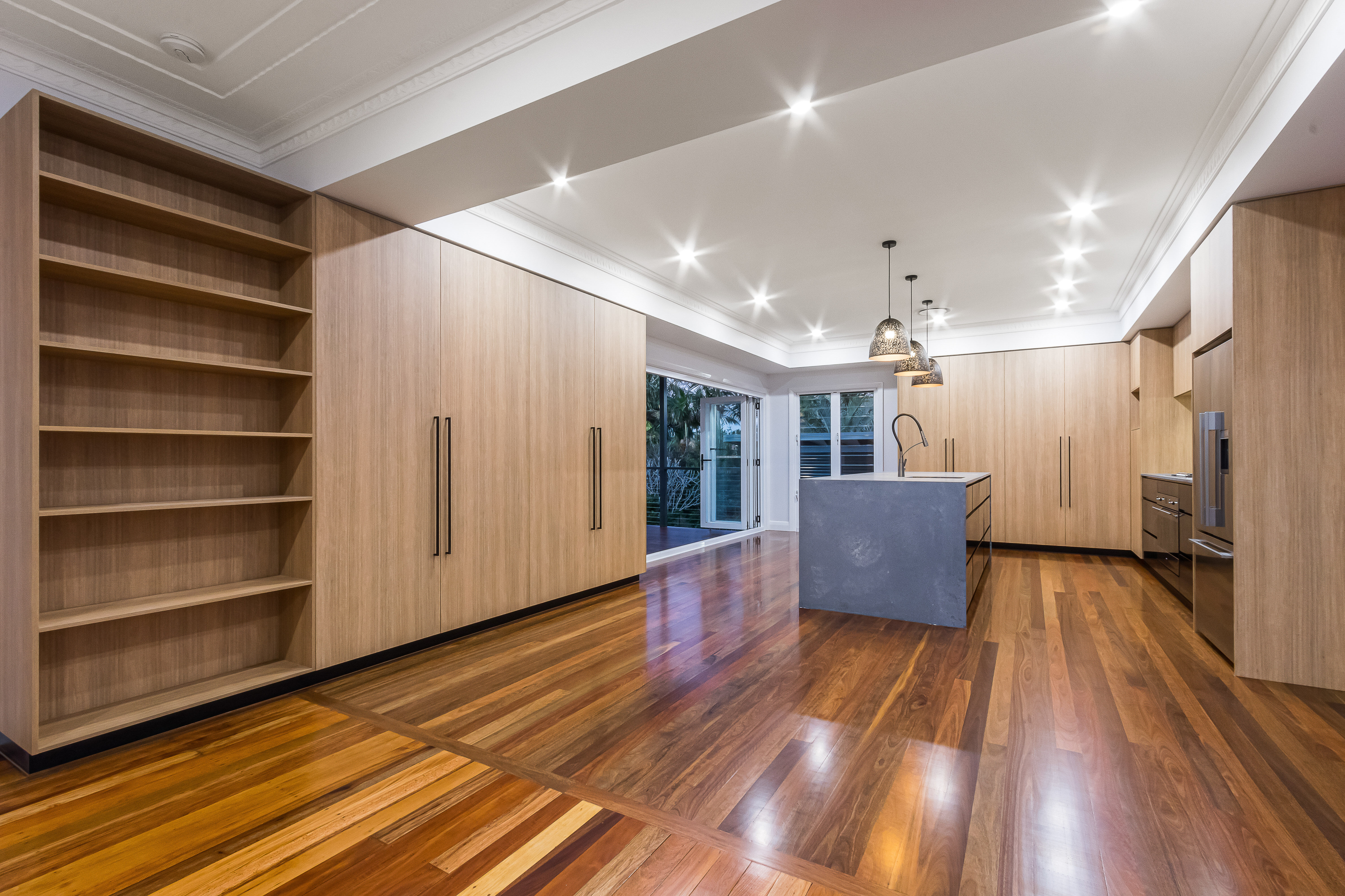 timber kitchen-marble tiles-splashback-stone benchtop- timber flooring- black handles