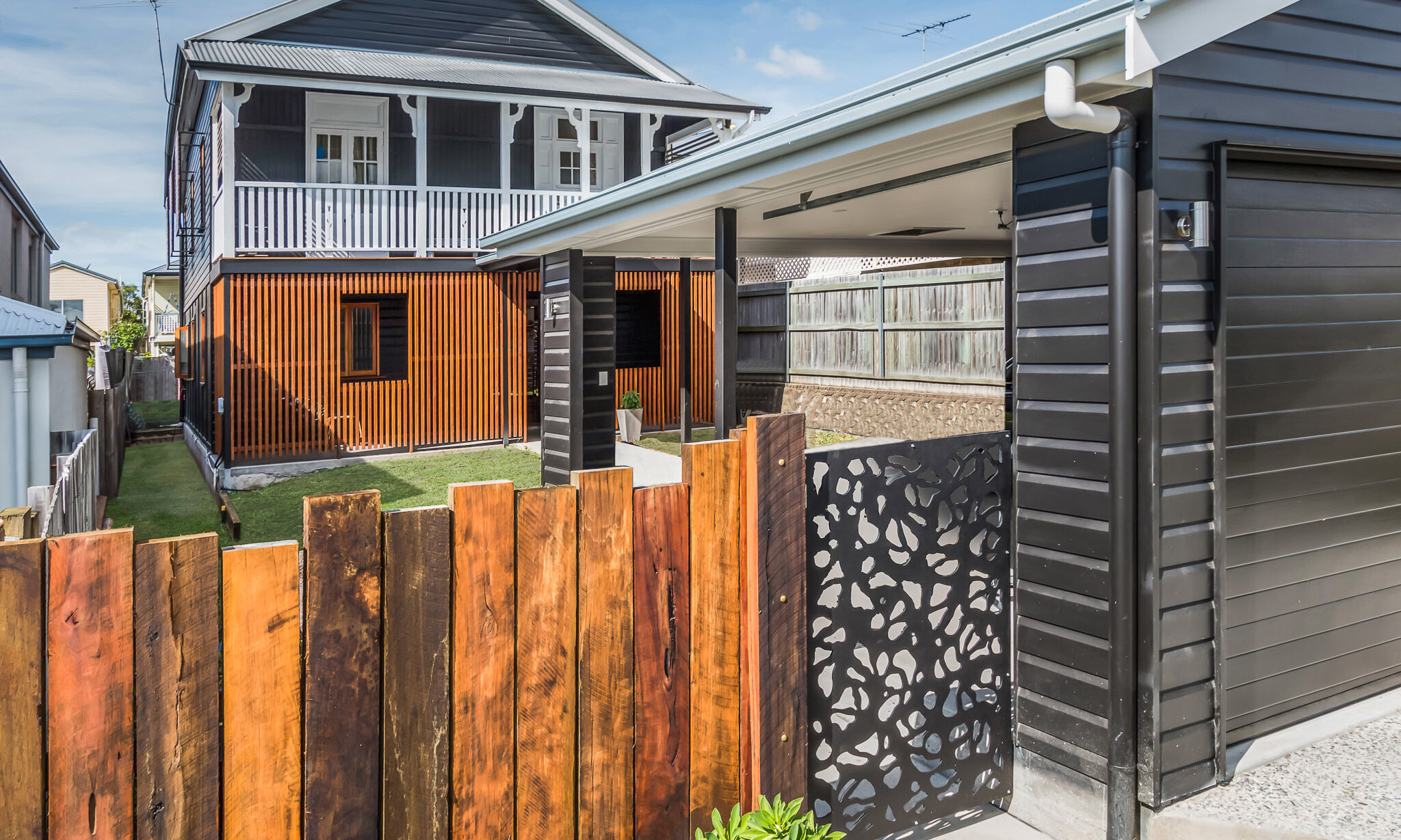 Black and White house with timber battening in Cannon Hill