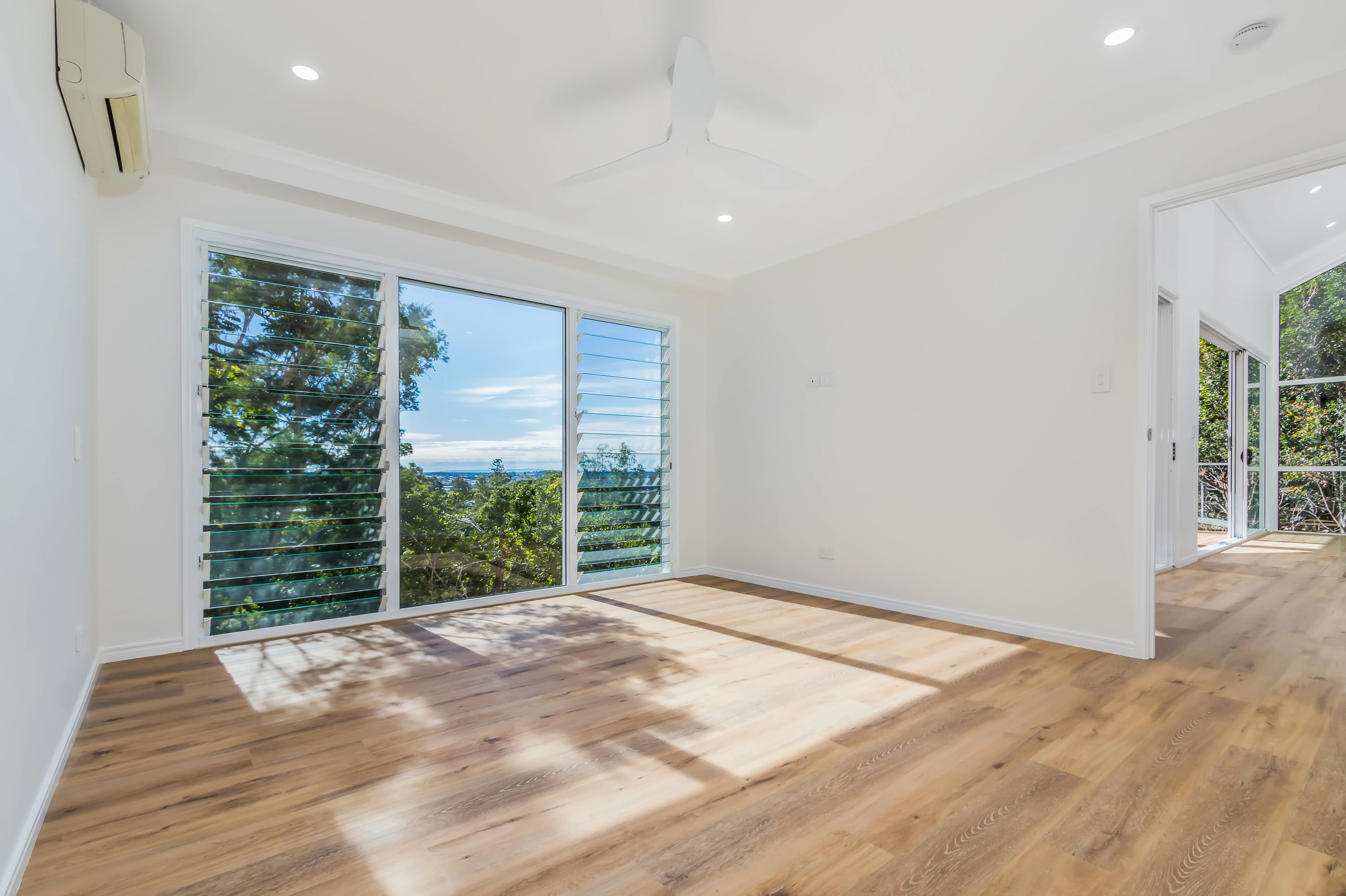 Bedroom- louvred windows-timber floors
