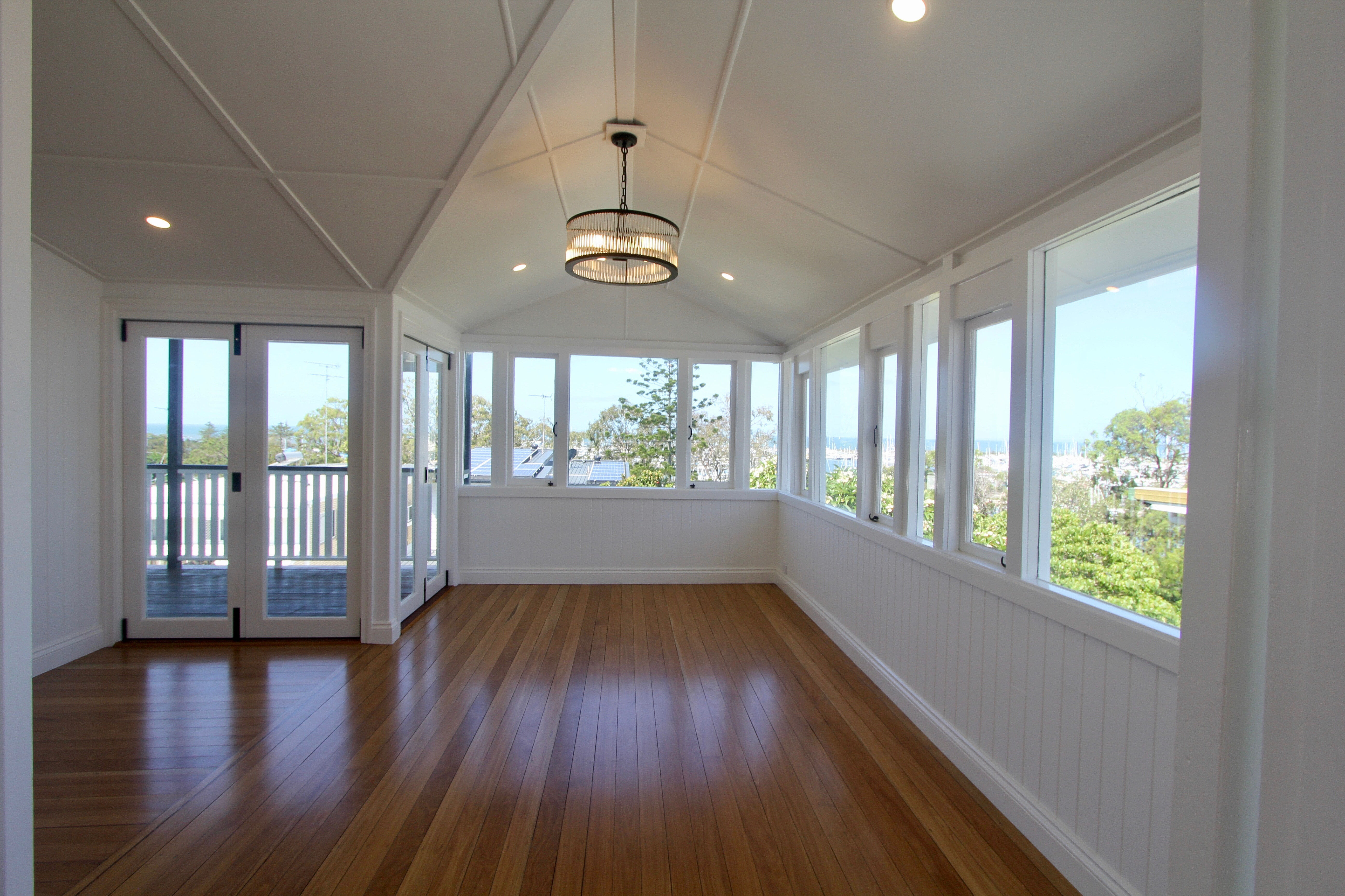 Bifold doors, Timber floors and pendant light in dining room