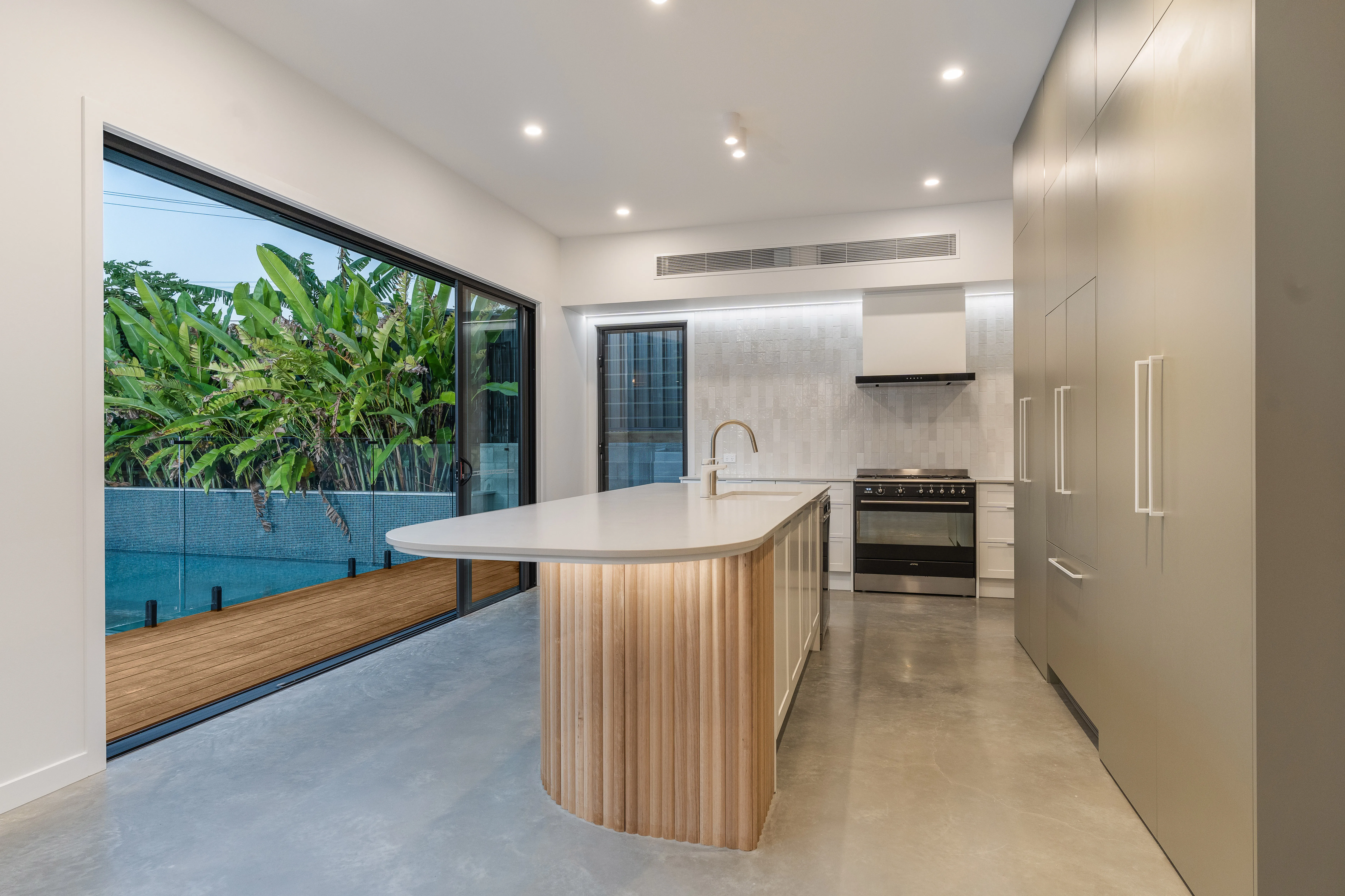 Kitchen island-polished floors-fluted panels