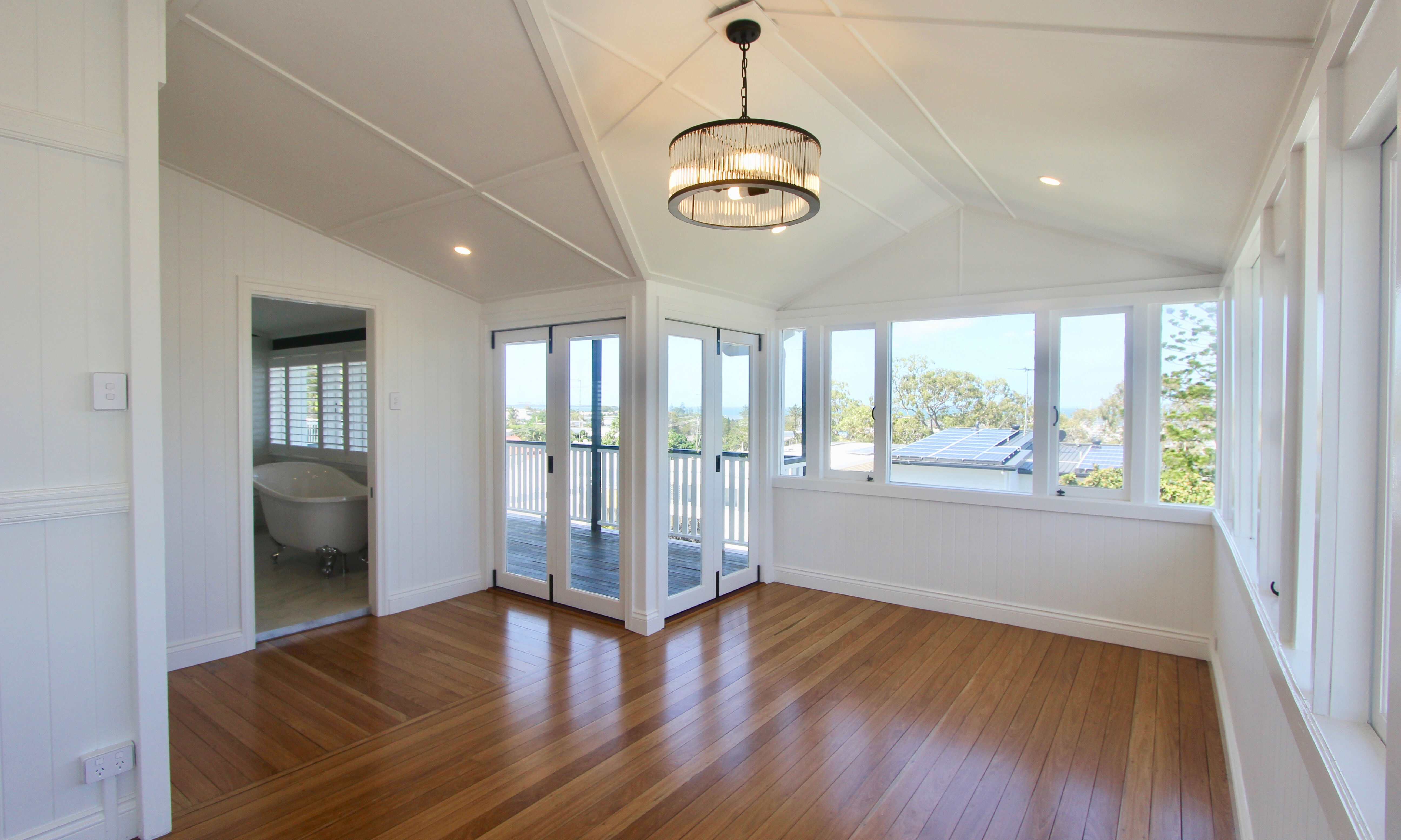 Timber floors and pendant light in dining room