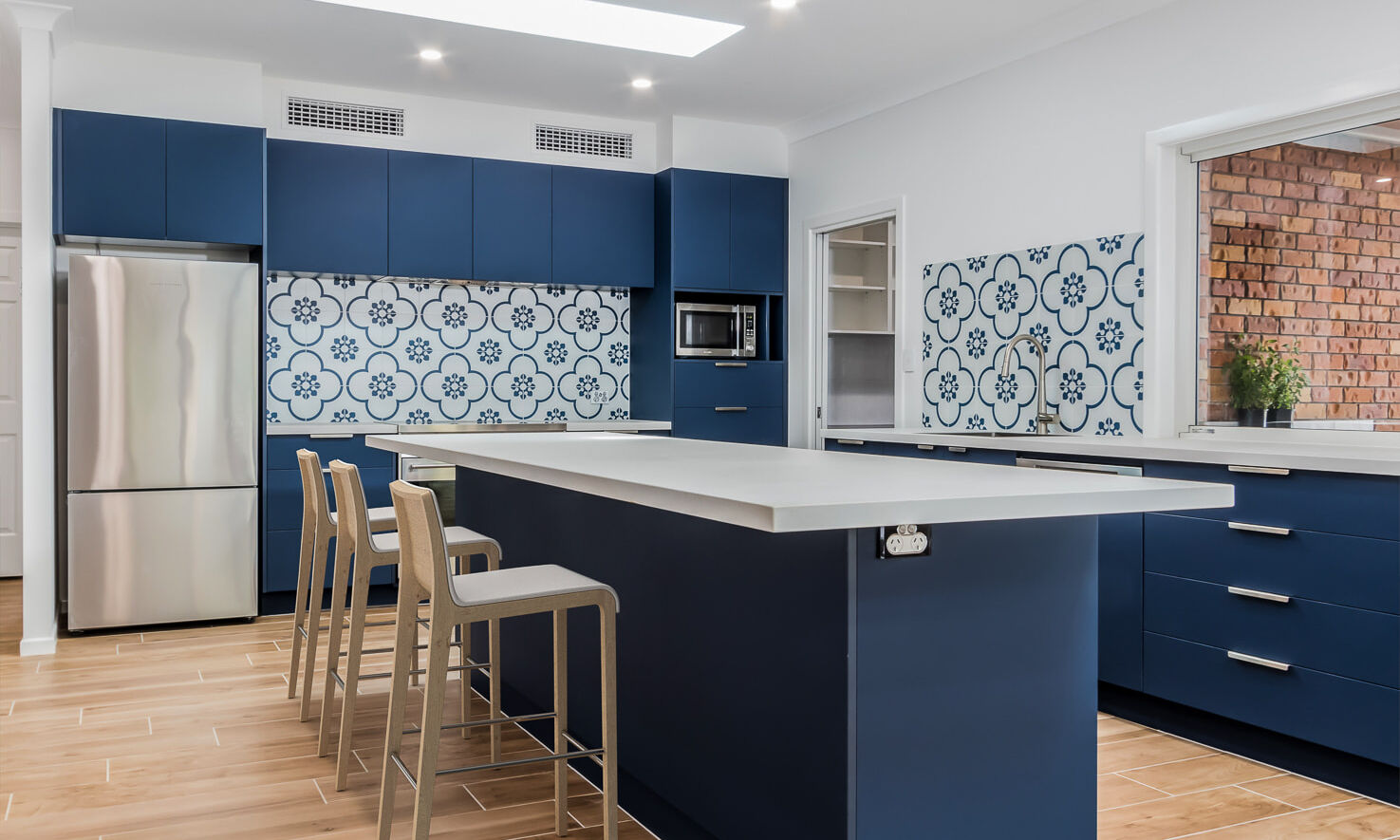 Blue Kitchen with blue and white tiles