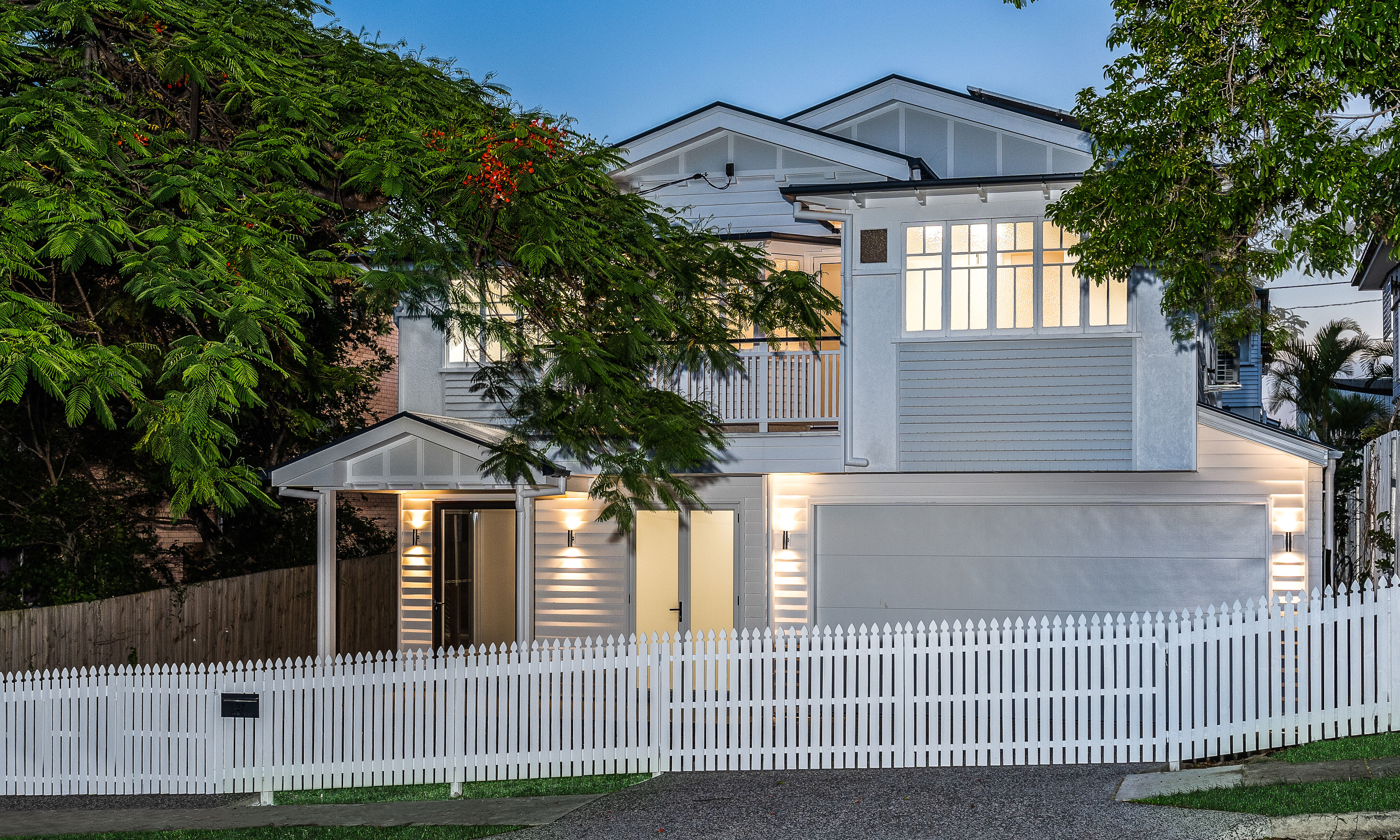 white and grey Queenslander house-traditional renovation-picket fence