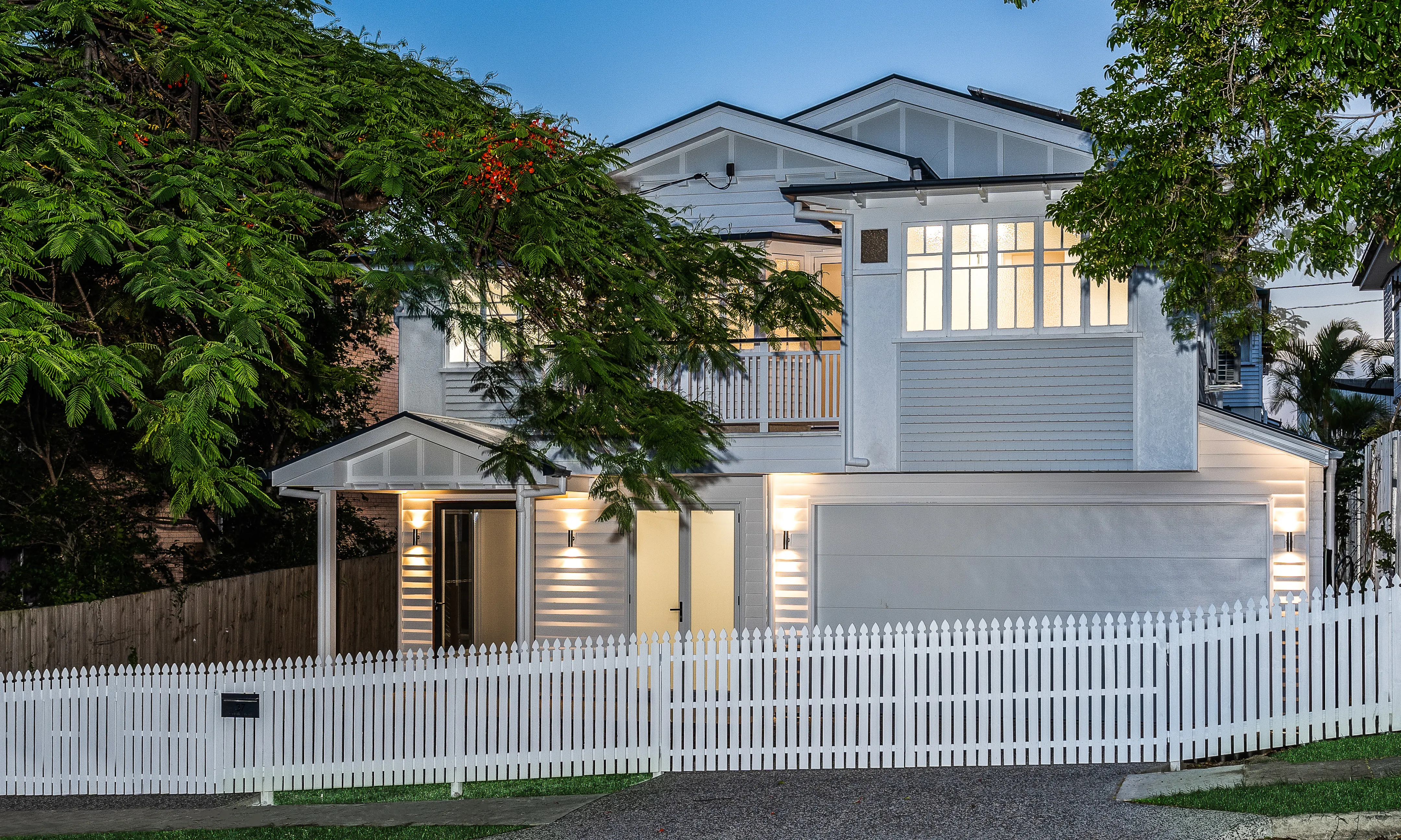 white and grey Queenslander house-traditional renovation-picket fence