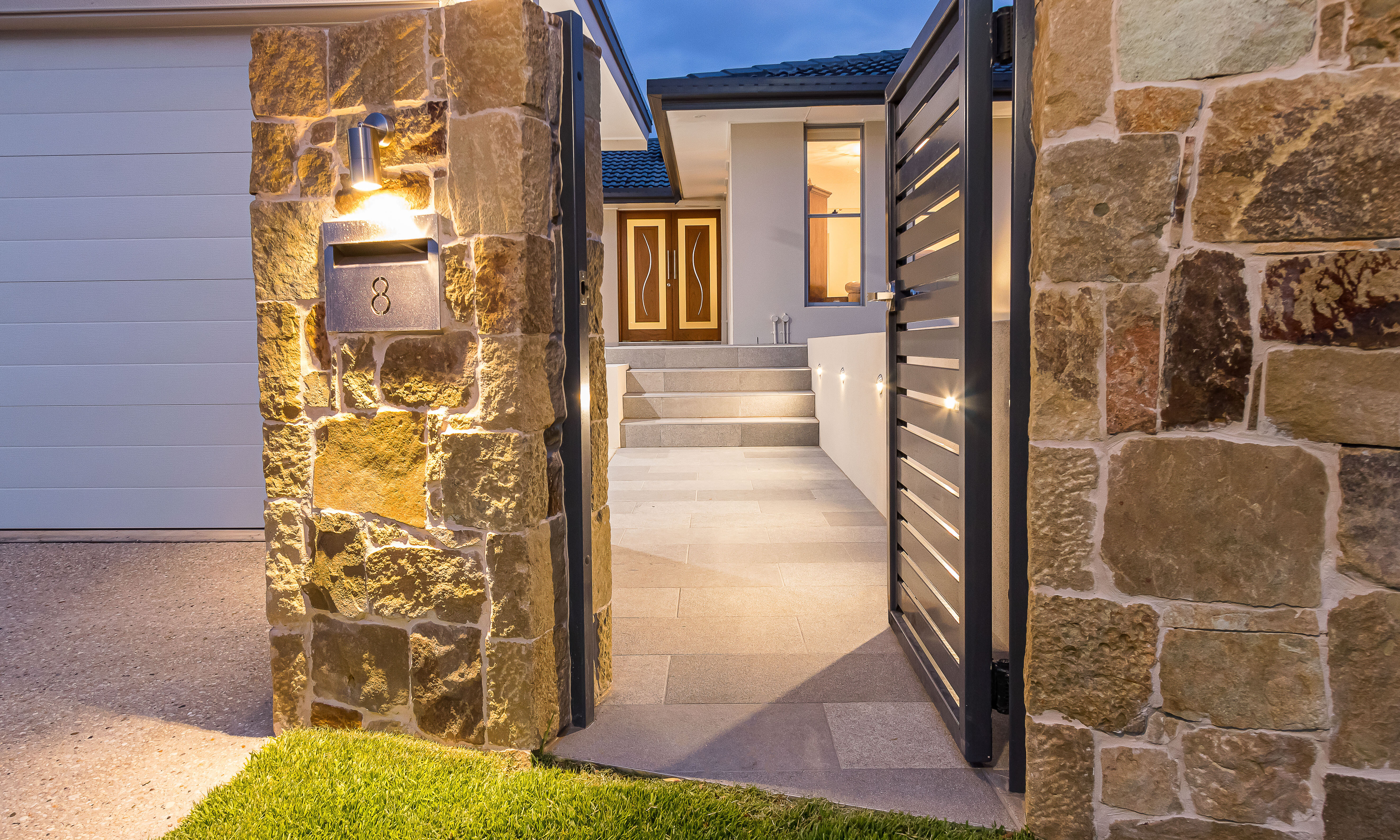 Clancy wall cladding and magma rock feature tiles at entry