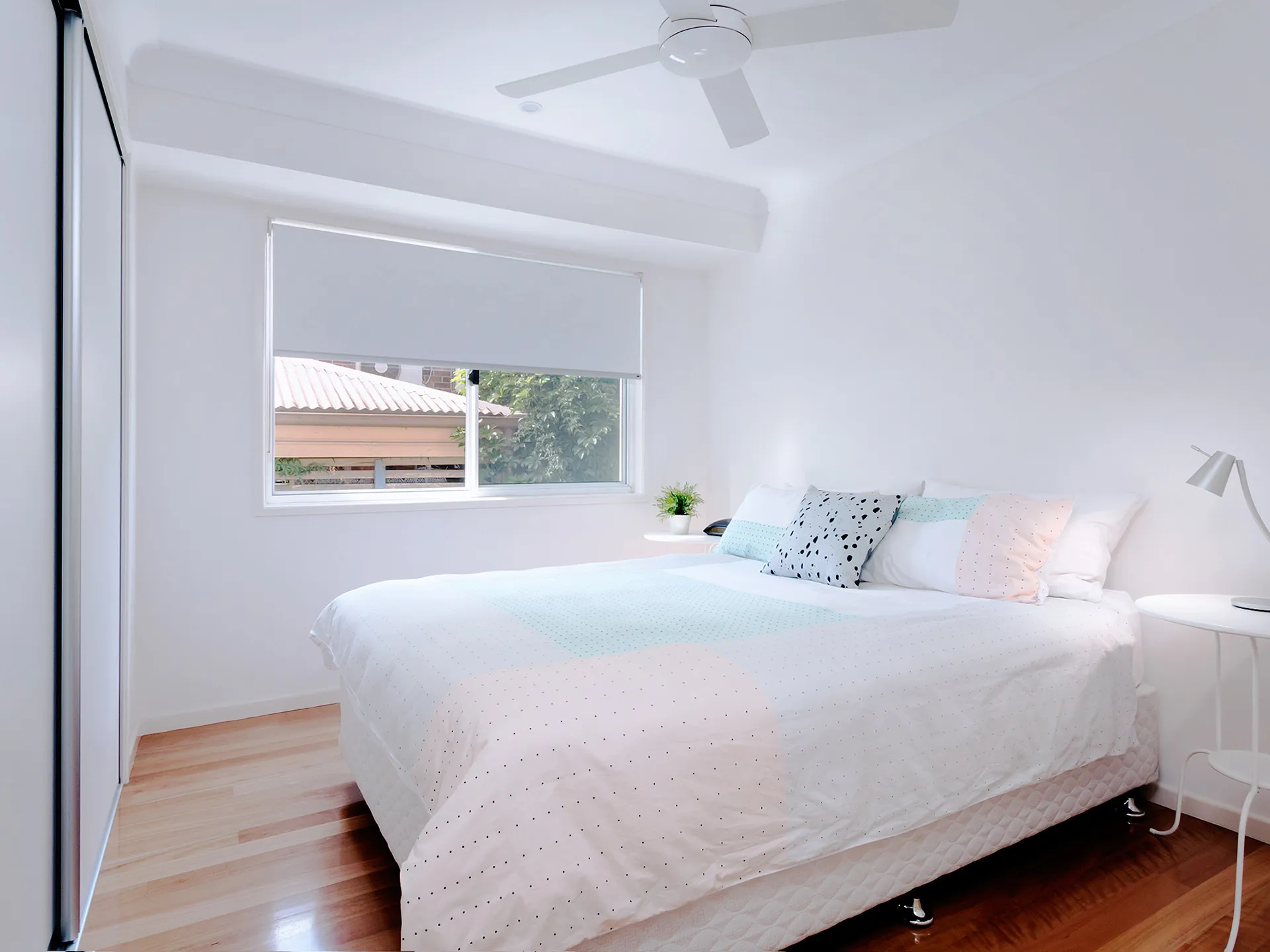 Bedroom with white sliding robe doors