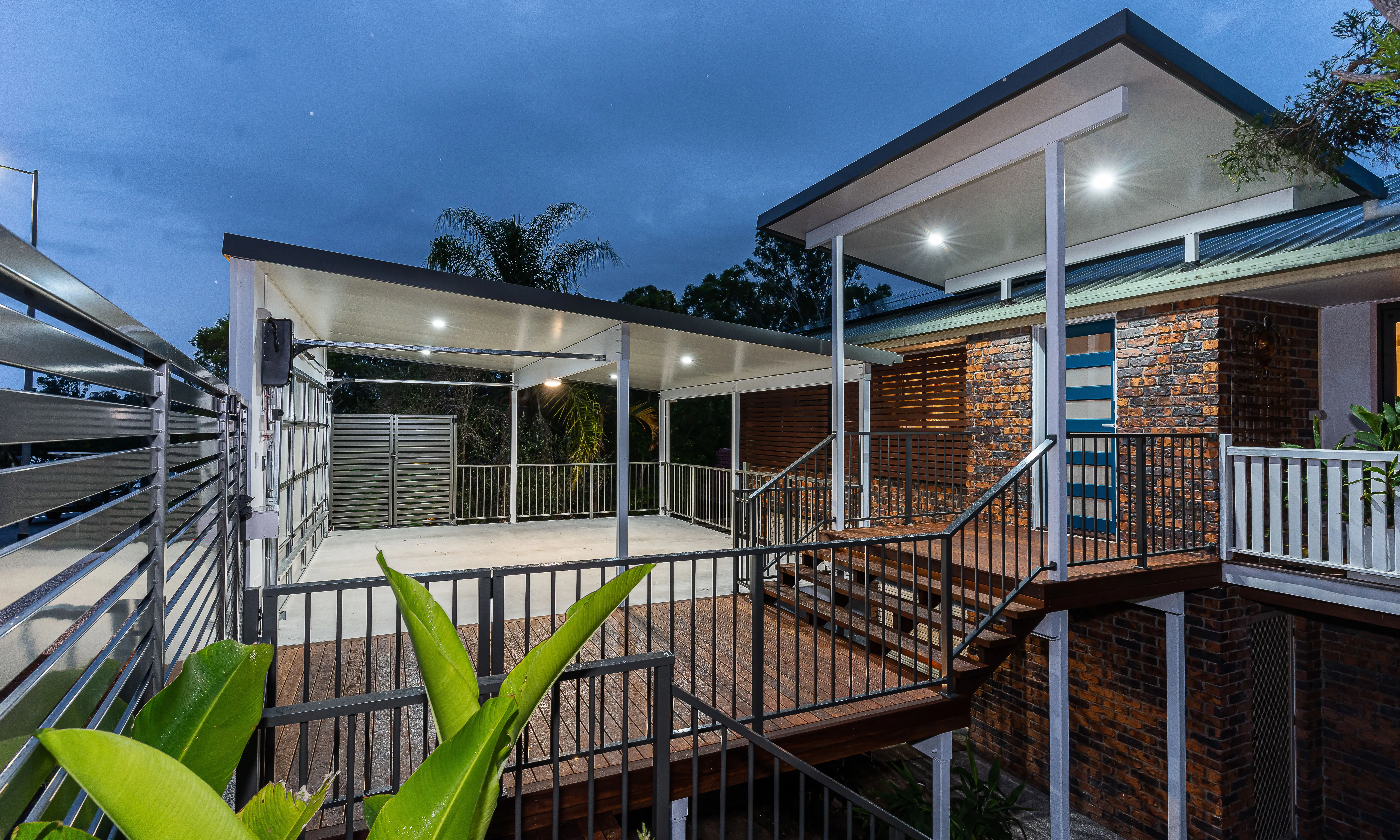 Front entry, deck and balustrade with Carport