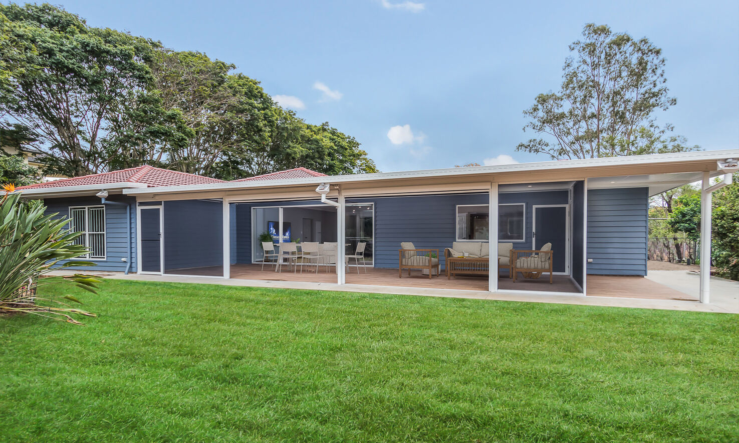 Back Yard of single storey blue weatherboard house