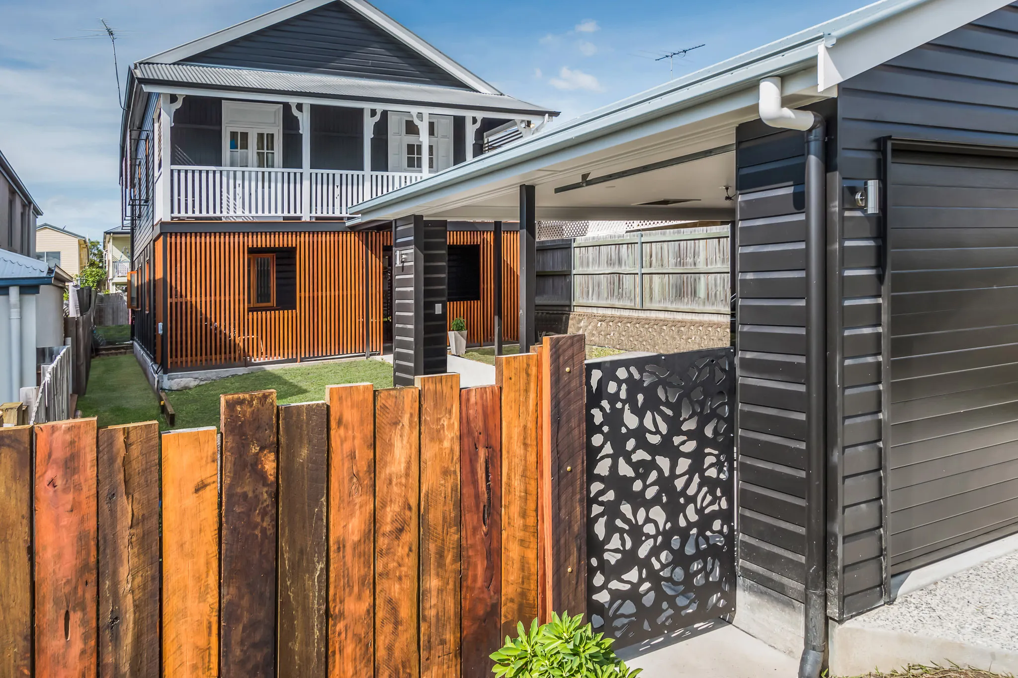 Black and White house with timber battening in Cannon Hill