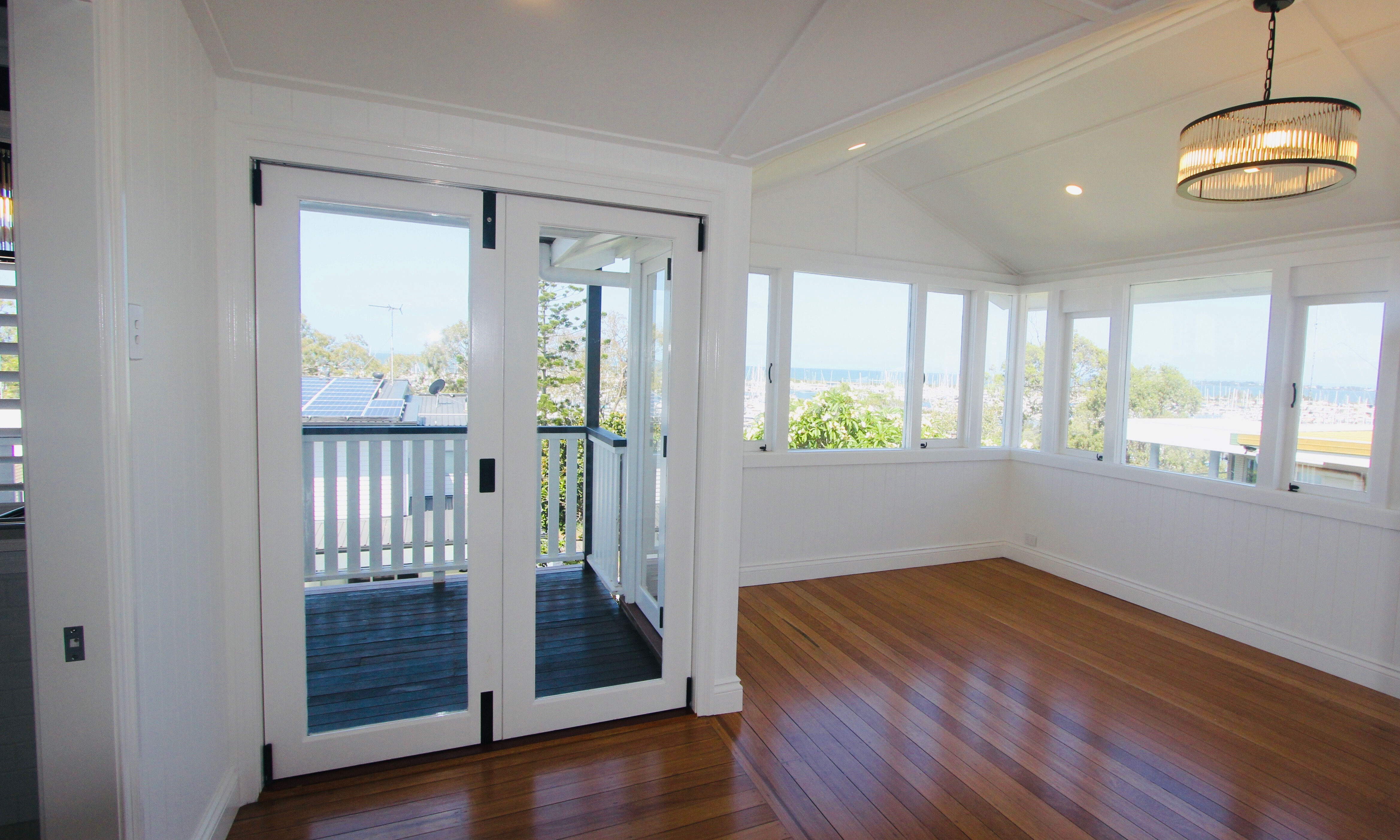 White Bifold doors with black handles