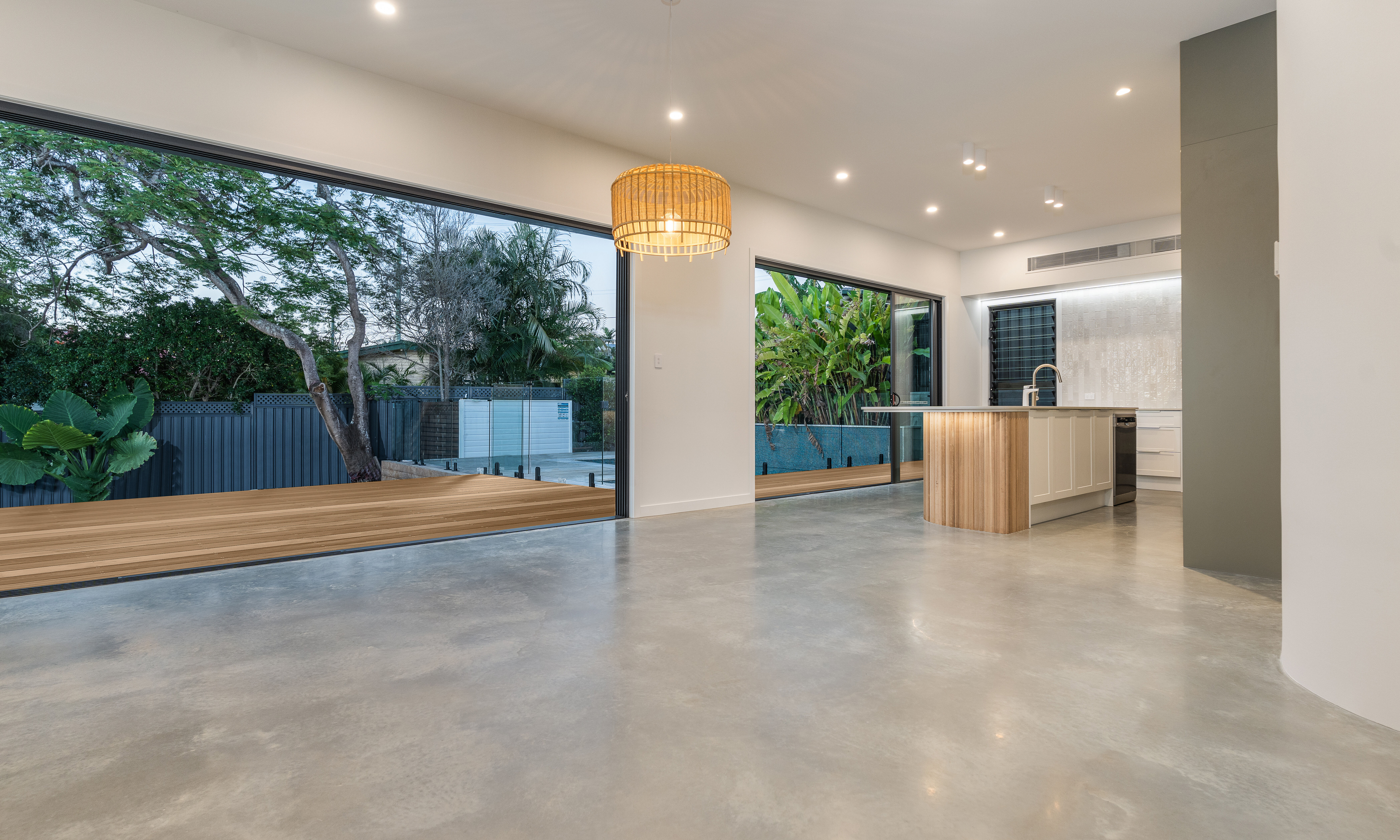 Living room-polished floors- Stacker door-pool-deck