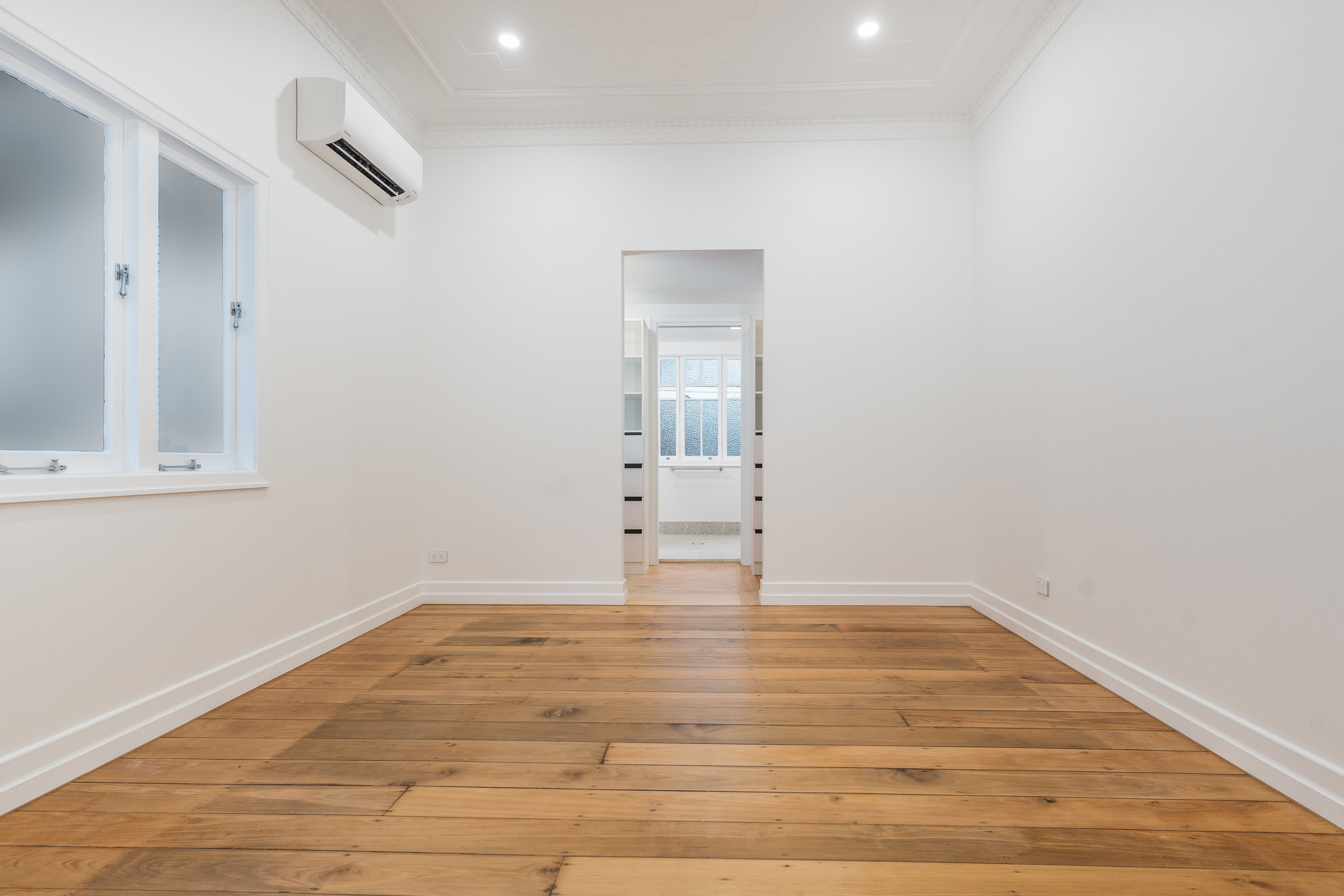 bedroom-pine flooring-casement windows