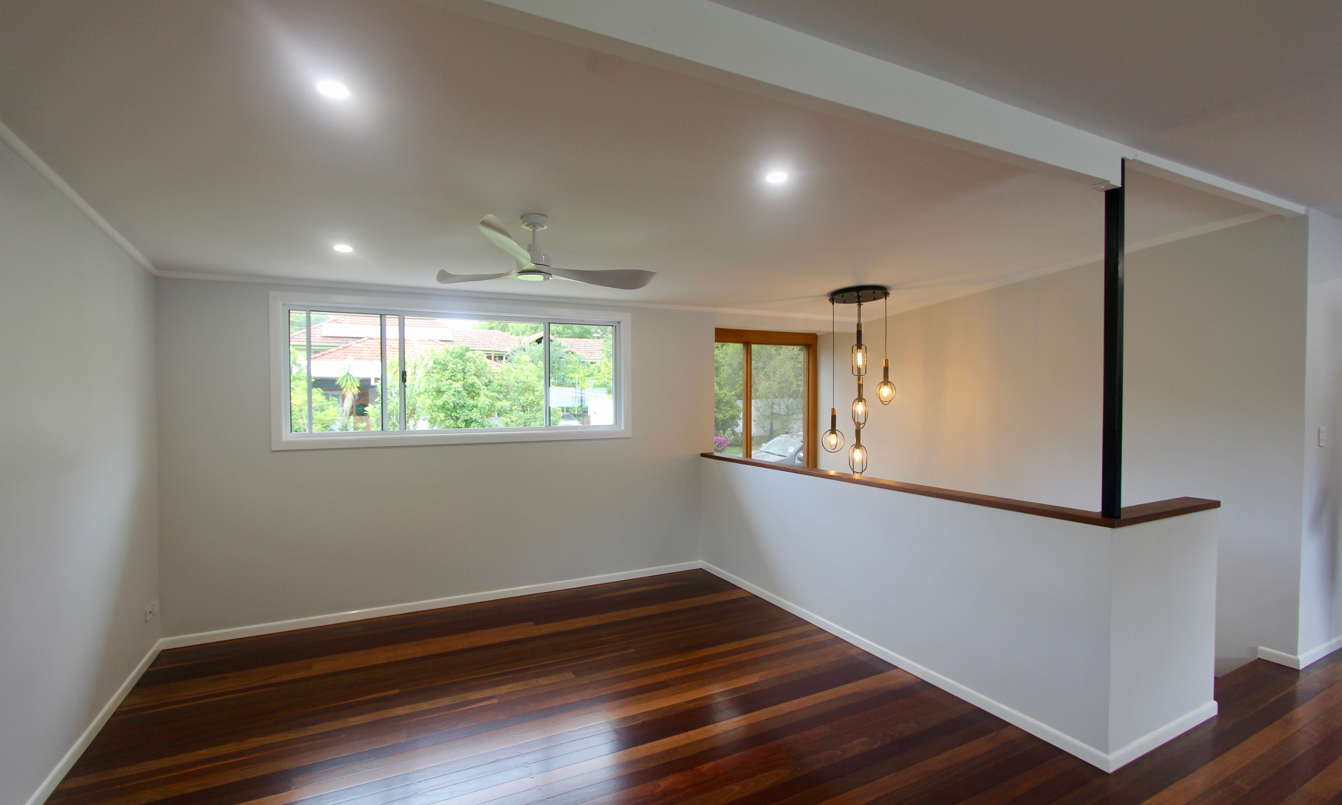 Living room and pendant light in front entry