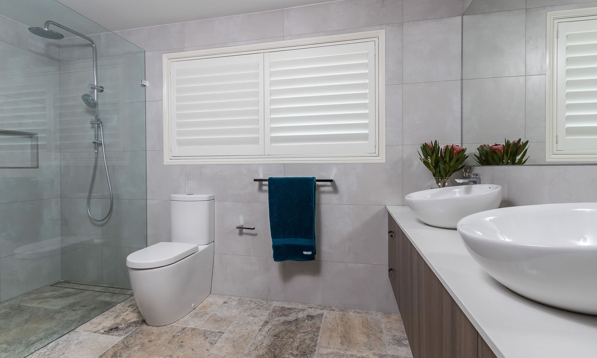 Bathroom-glass shower screen-travertine tiles