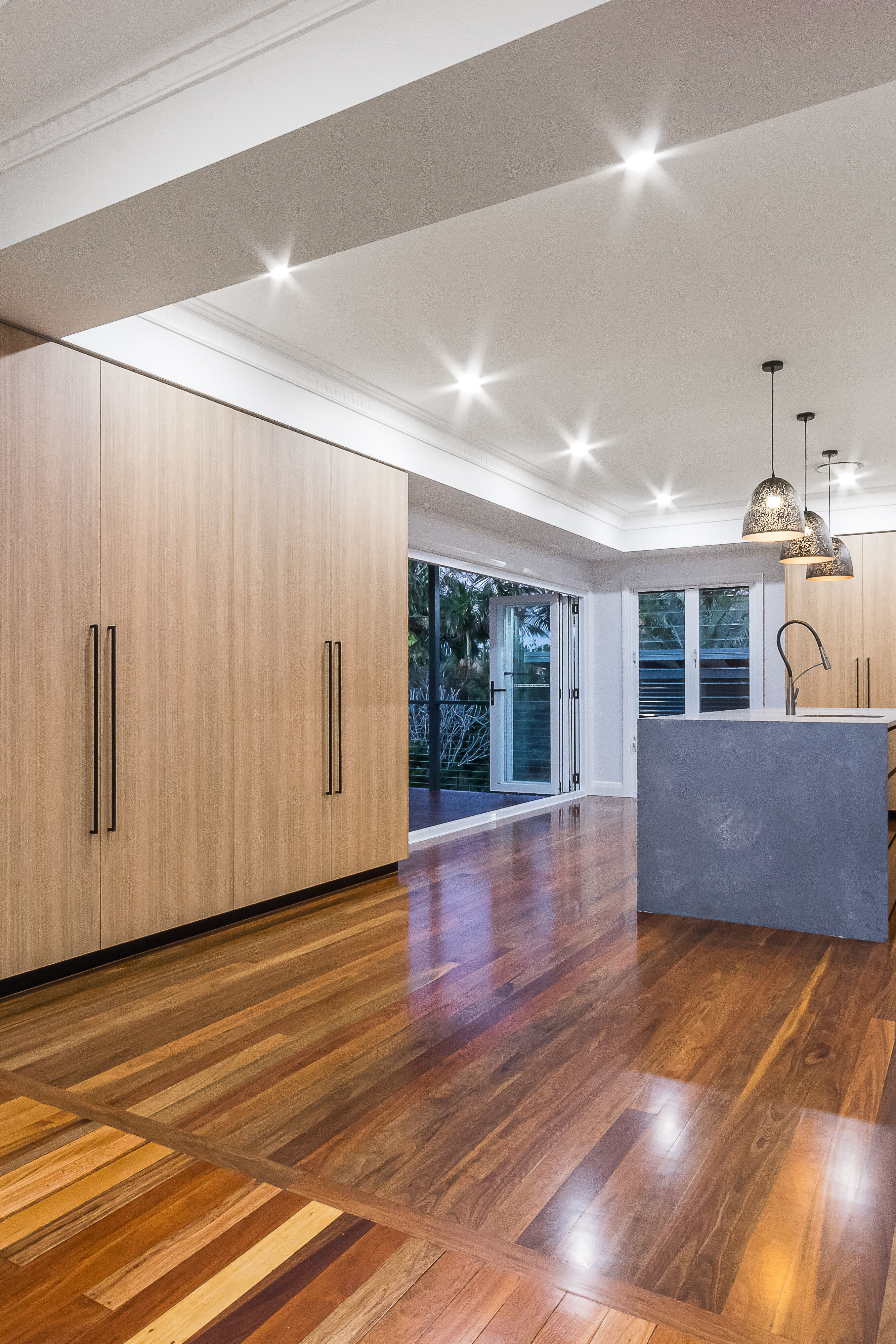 timber kitchen-marble tiles-splashback-stone benchtop- timber flooring- black handles