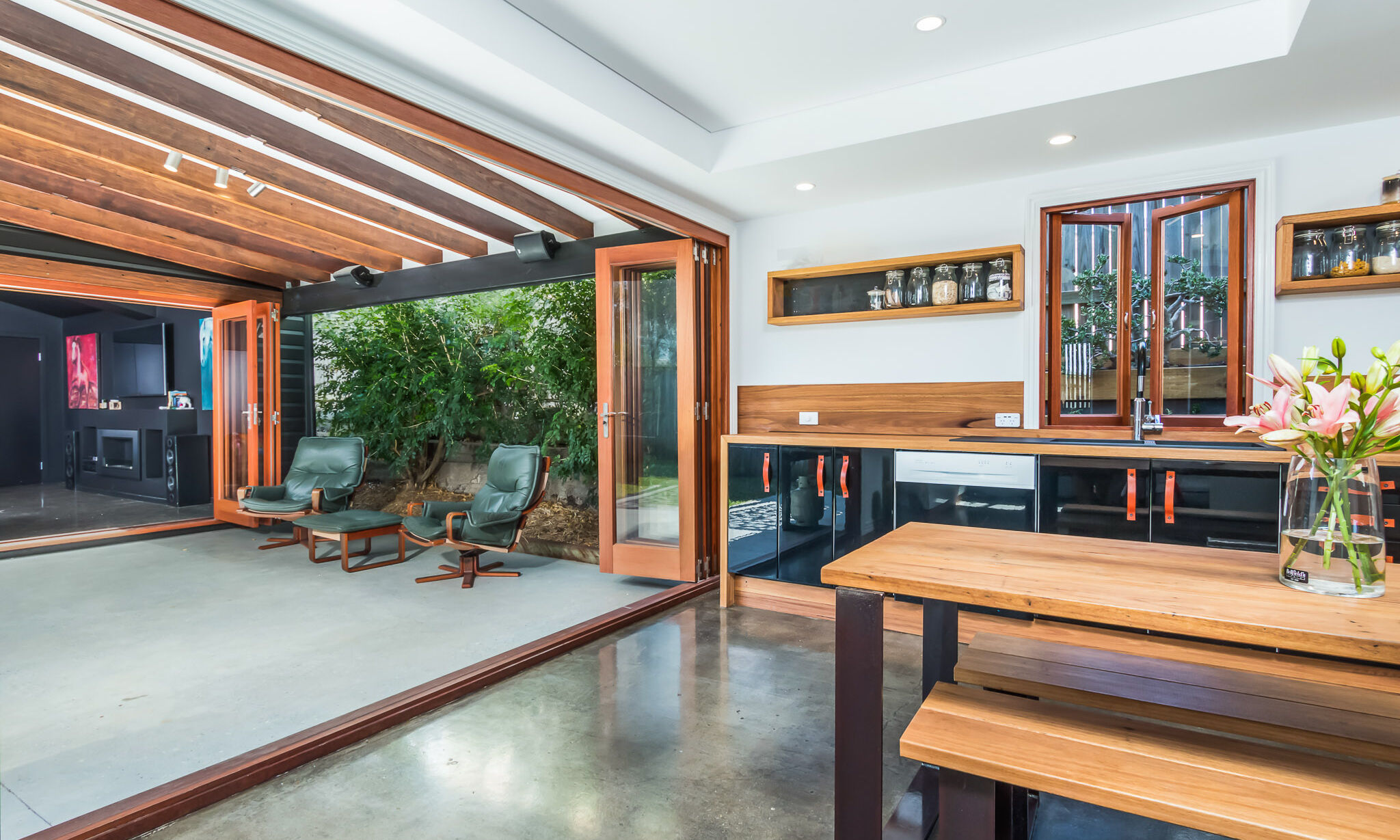 Timber Bifold Doors off kitchen to parents retreat