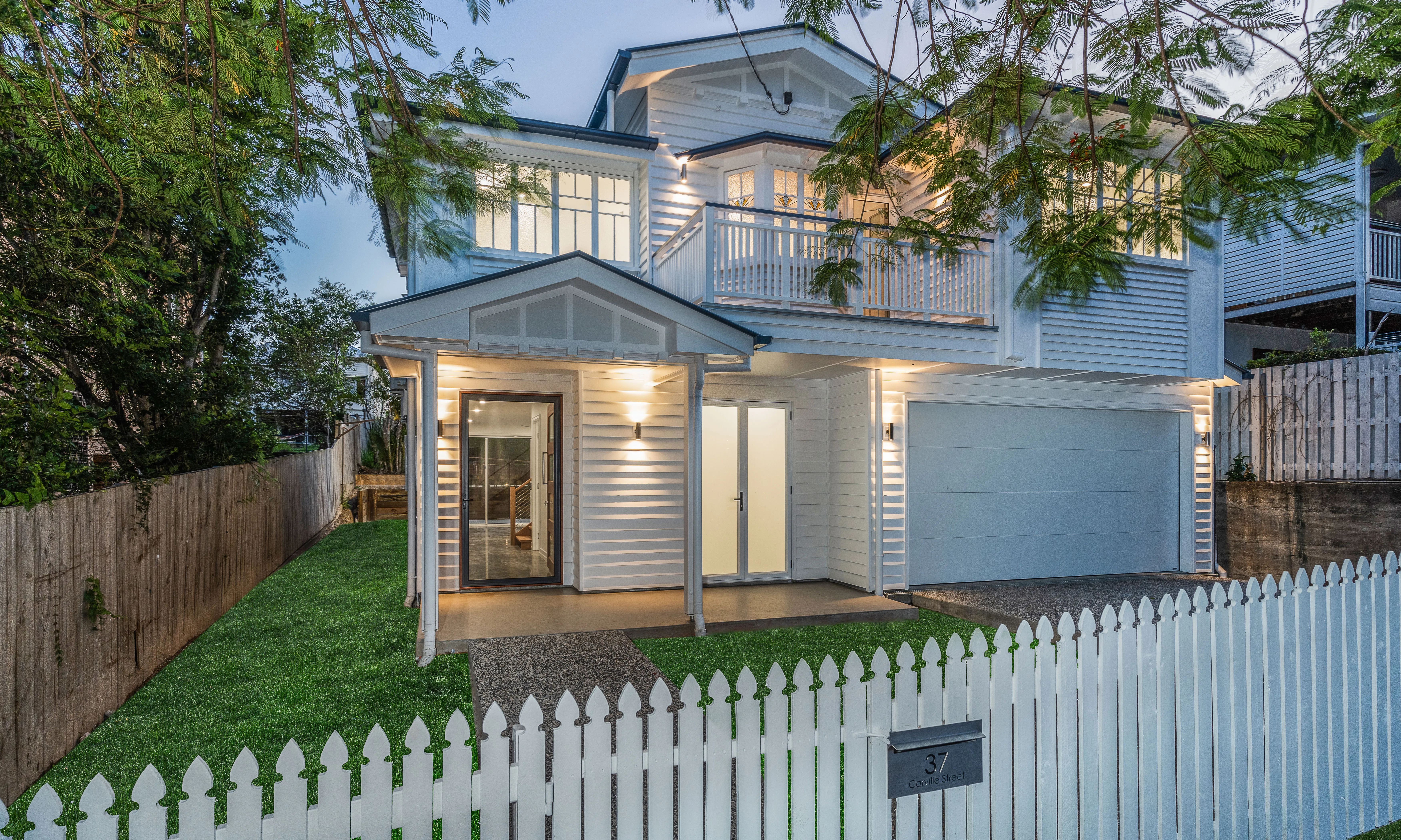 Queenslander renovation-weatherboard house-balcony- white house-picket fence