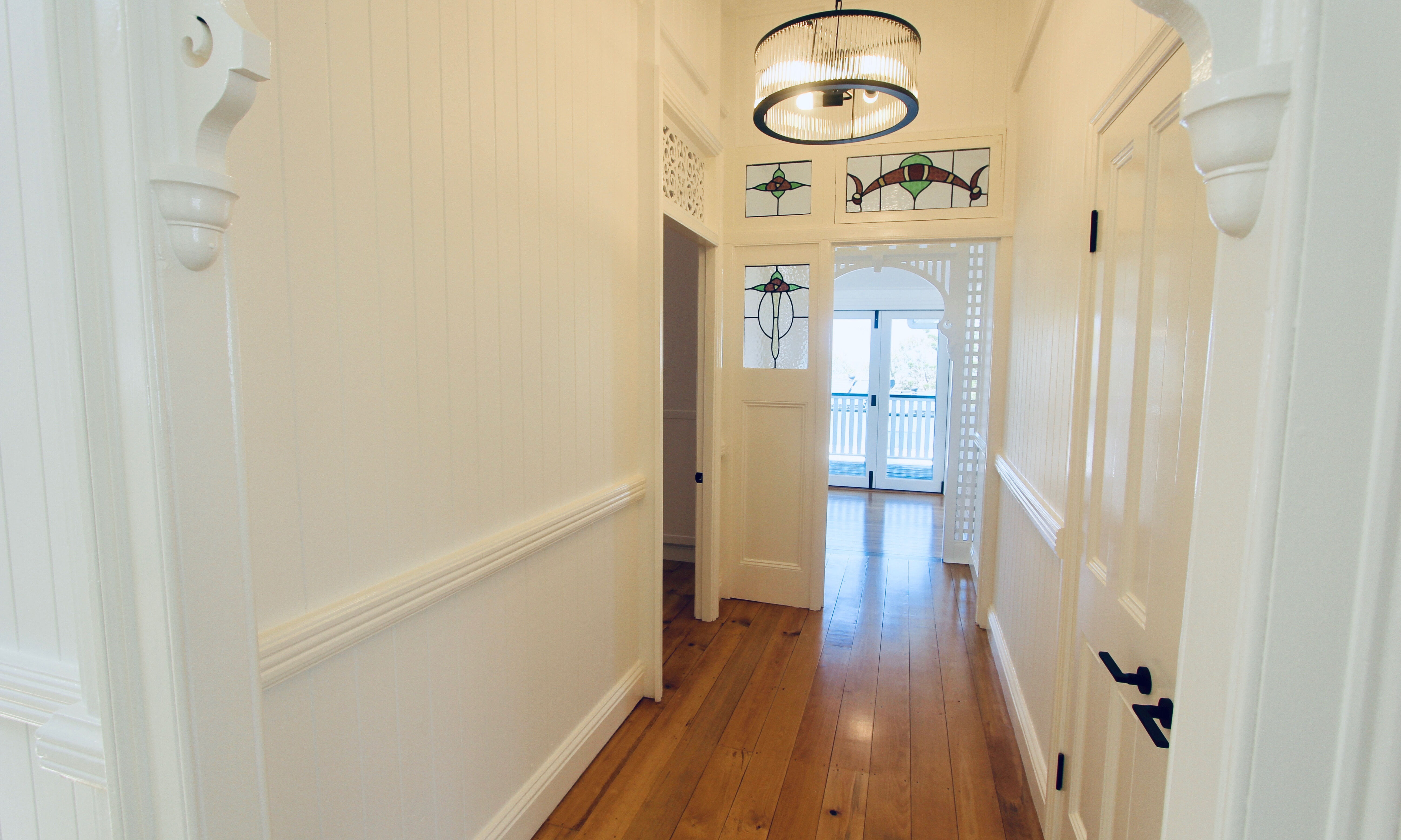 Fretwork and pendant light in hallway